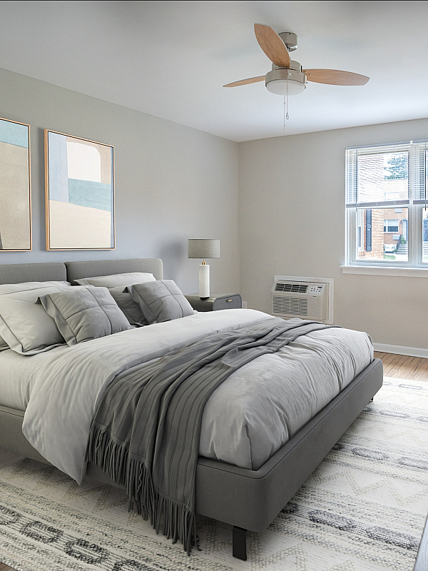Inviting bedroom with plush bedding, modern decor, and ample natural light from a large window.