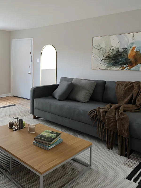Modern living room with sleek gray furniture, large window, and stylish decor including potted plants and abstract art.