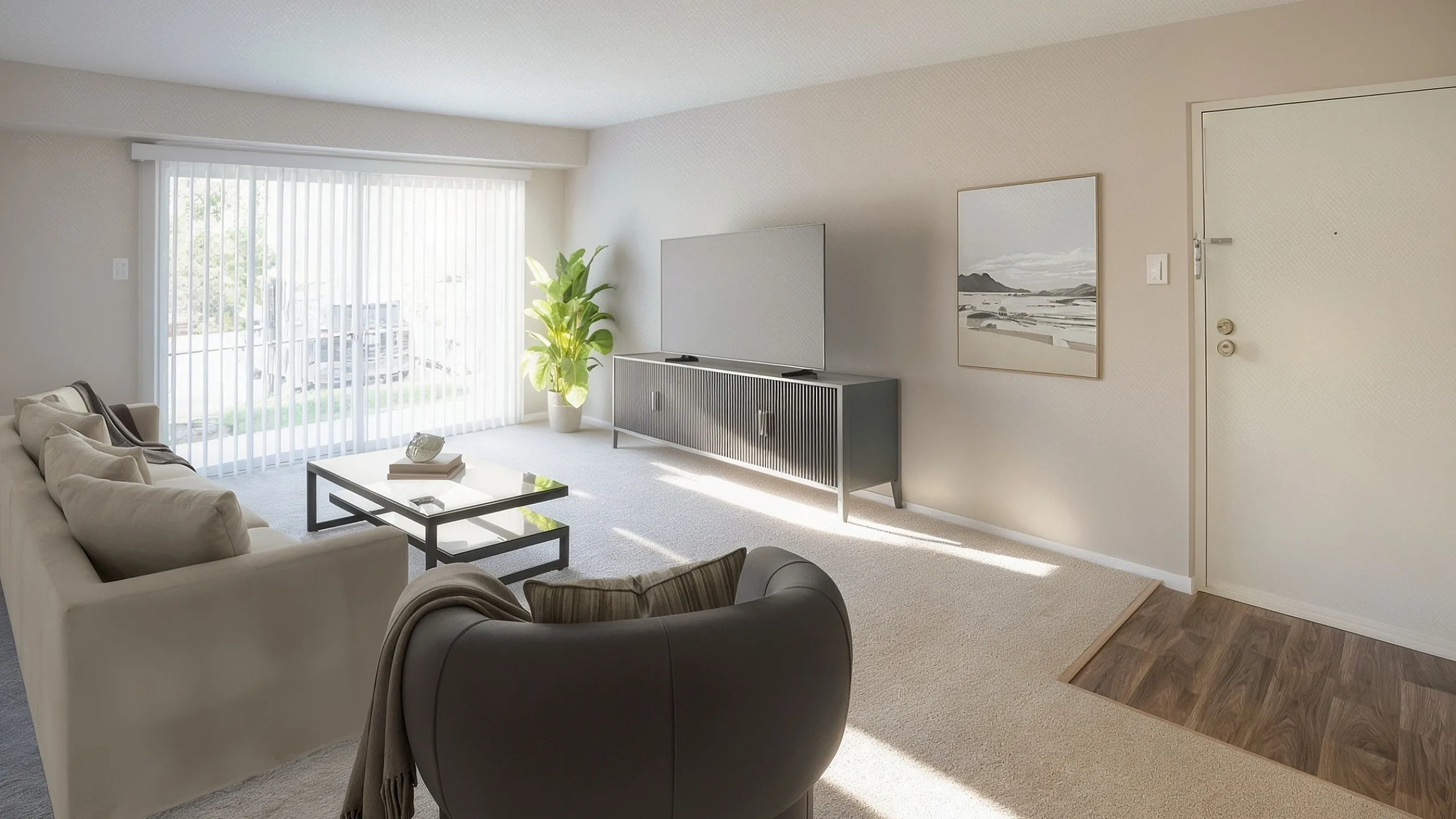 Bright and modern living room with plush sofas, sleek TV stand, and large glass doors leading to sunlit outdoors.