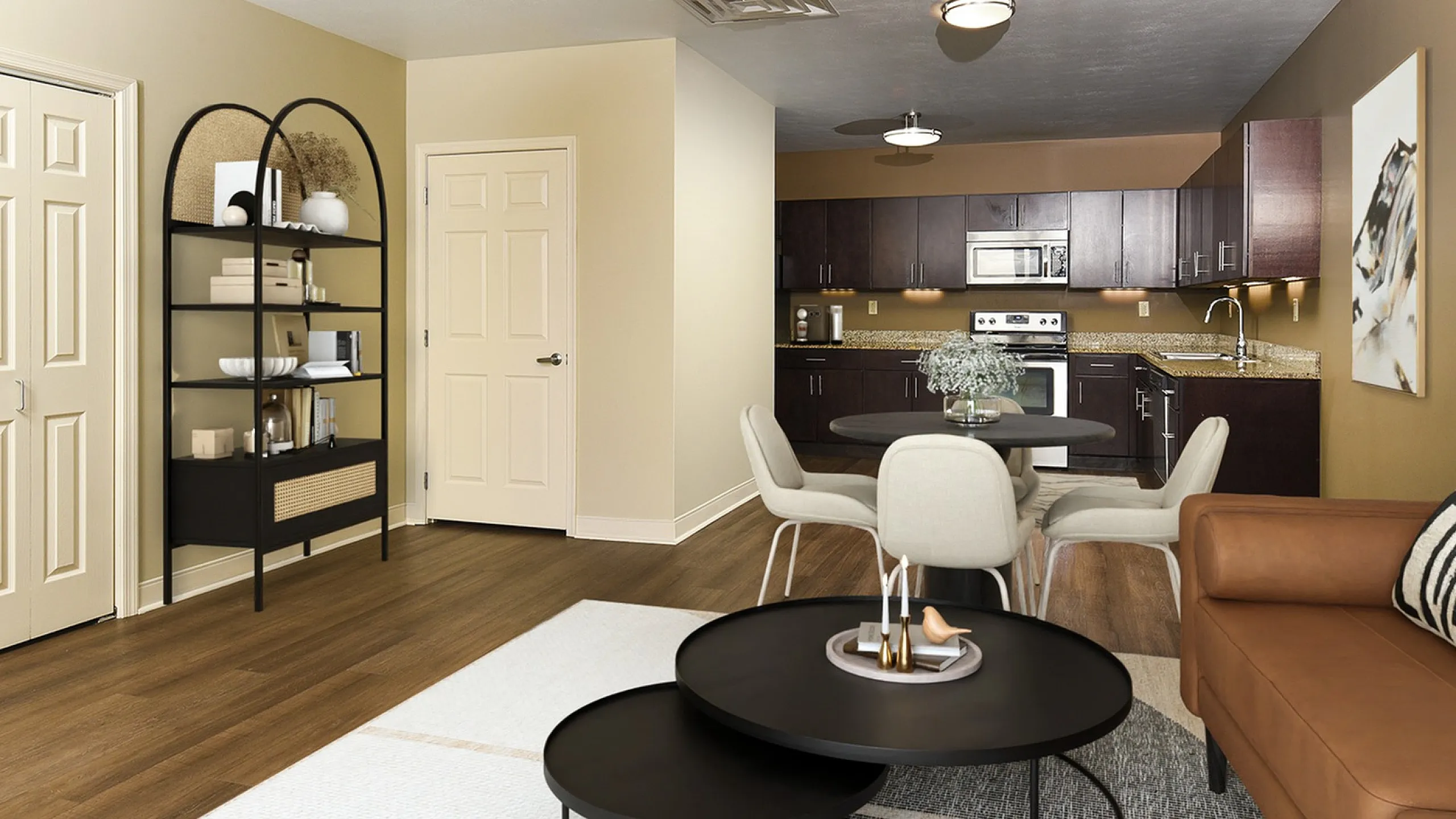 Inviting open-concept living space featuring a sleek kitchen with dark wood cabinets, cozy dining area, and stylish lounge adorned with modern decor.