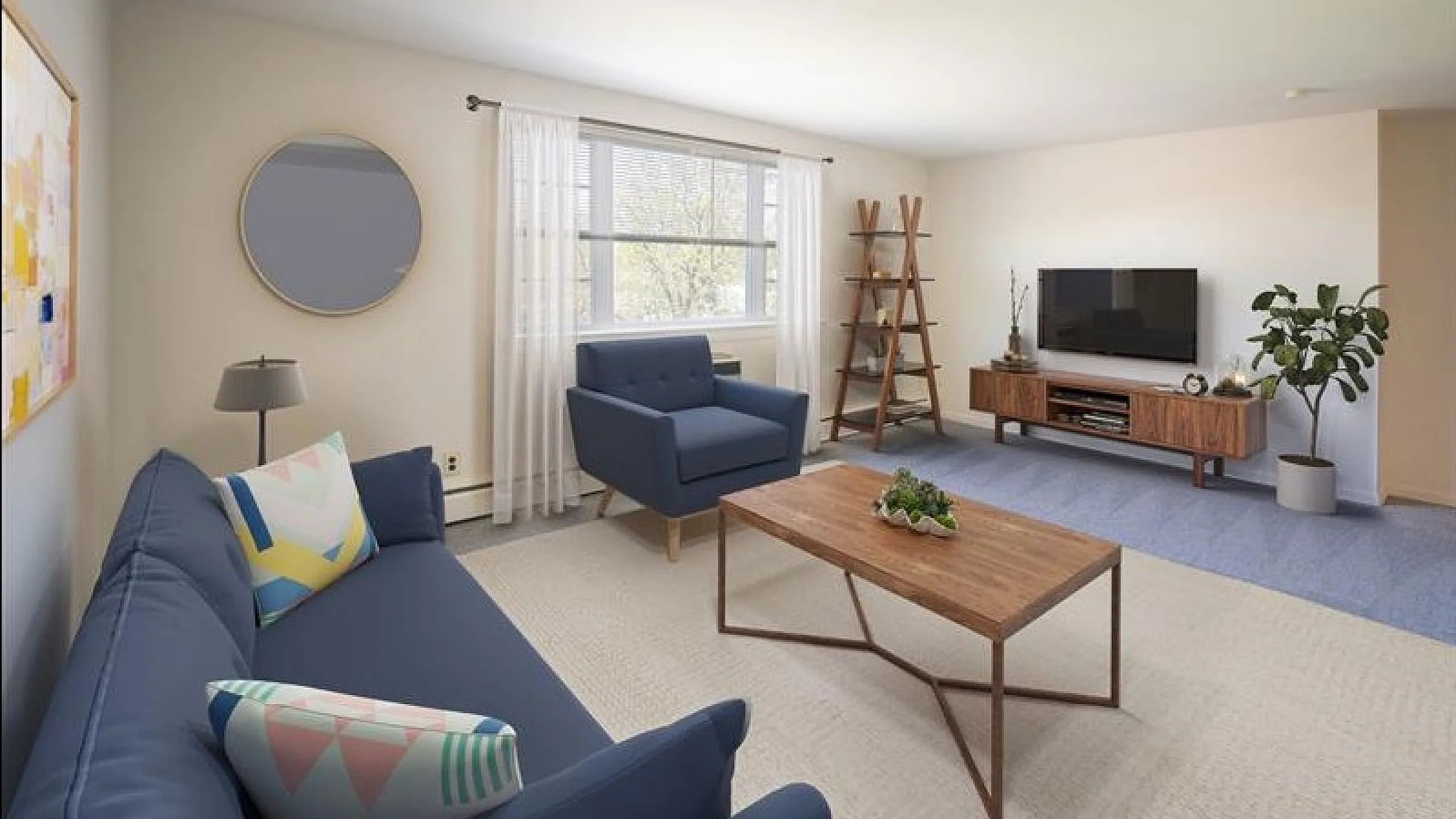 Modern living room with stylish blue furniture, large window, and sleek wooden furniture creates a cozy and welcoming atmosphere.