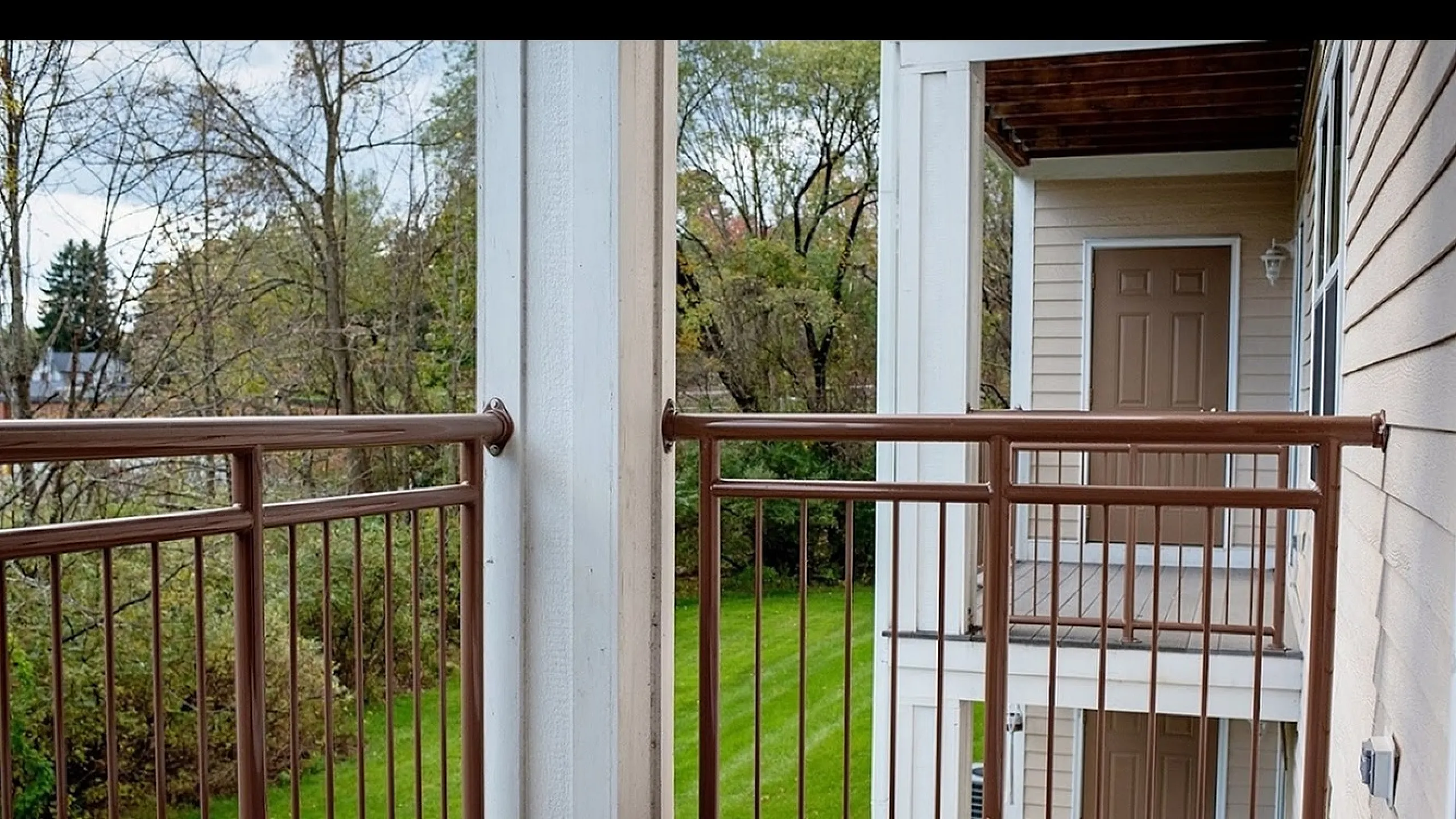 Charming balcony view with verdant greenery, perfect for relaxation in a serene setting.
