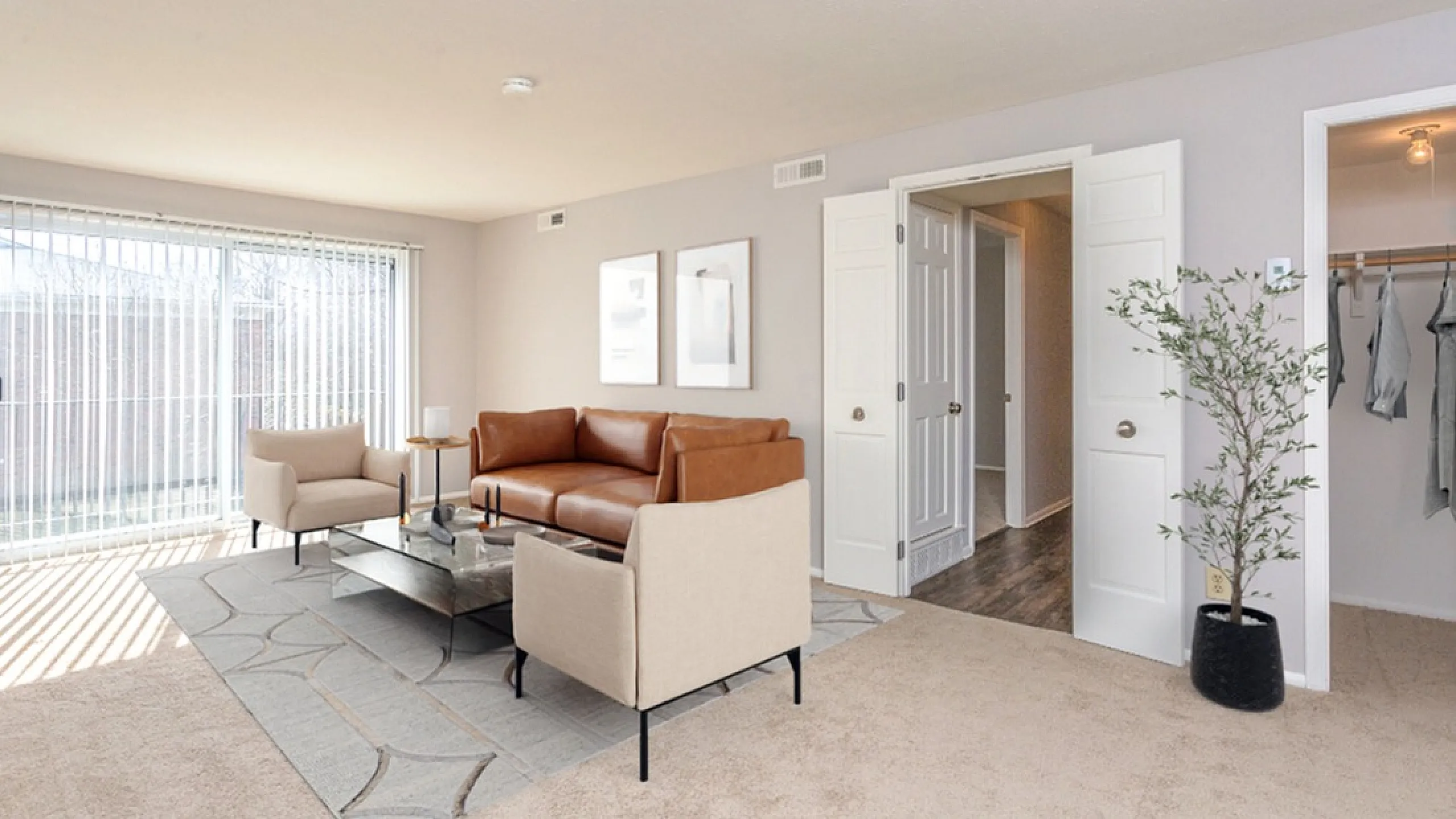 Bright and inviting living room with modern leather sectional, stylish armchairs, and natural light streaming through large windows.