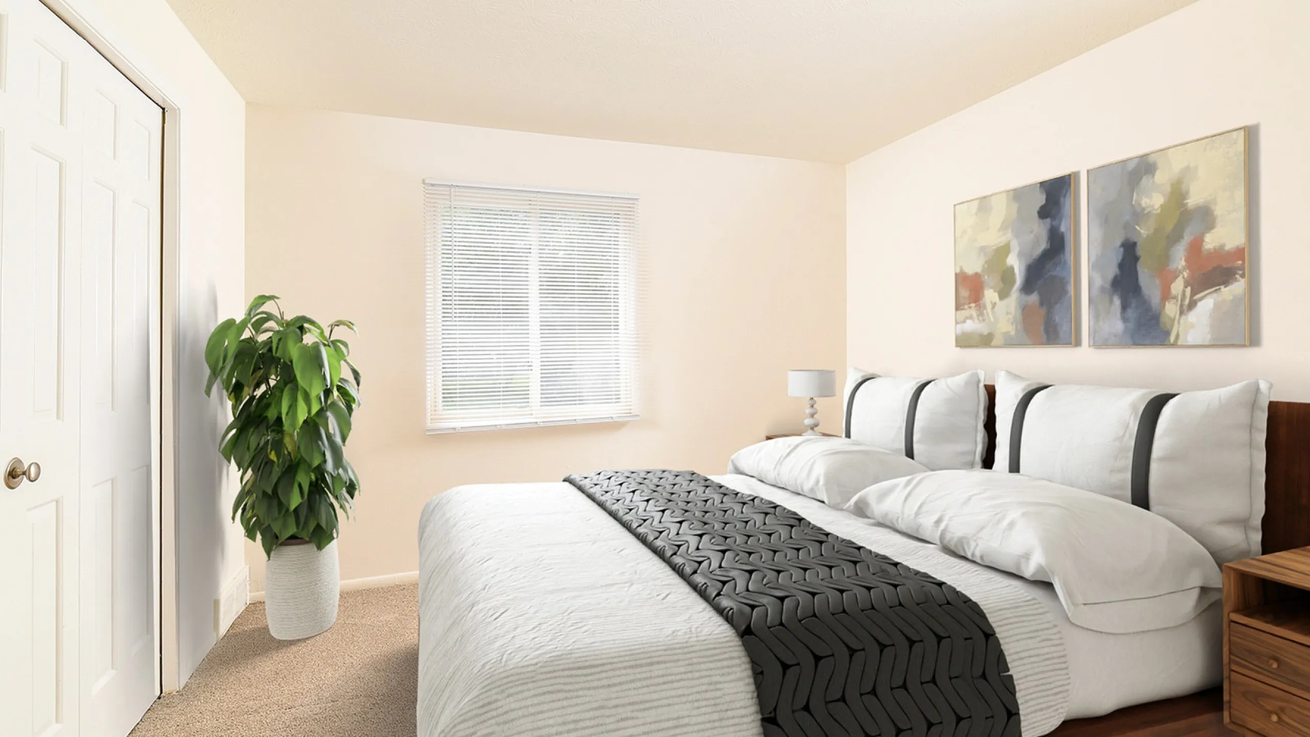 Inviting bedroom with plush bedding, modern artwork, and natural light, offering a serene oasis for relaxation.