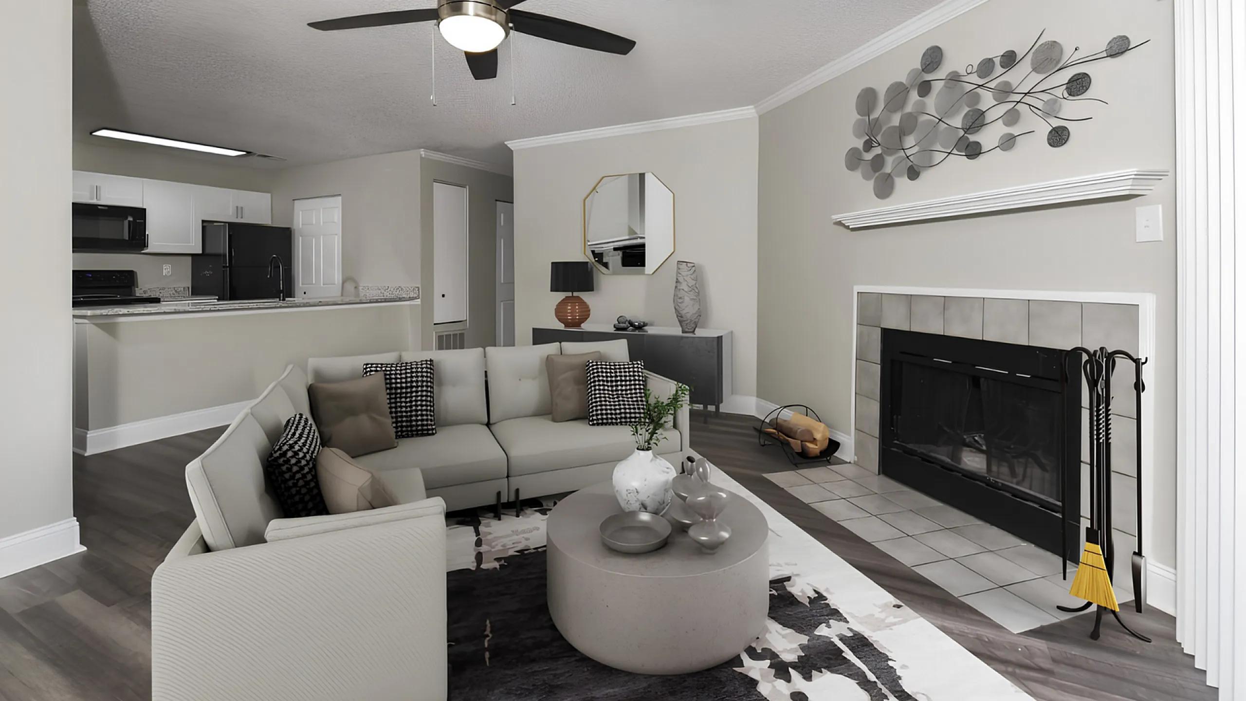 Elegant living space with modern decor, featuring a cozy sectional sofa, stylish wall art, sleek fireplace, and open kitchen with chic black and white cabinetry.