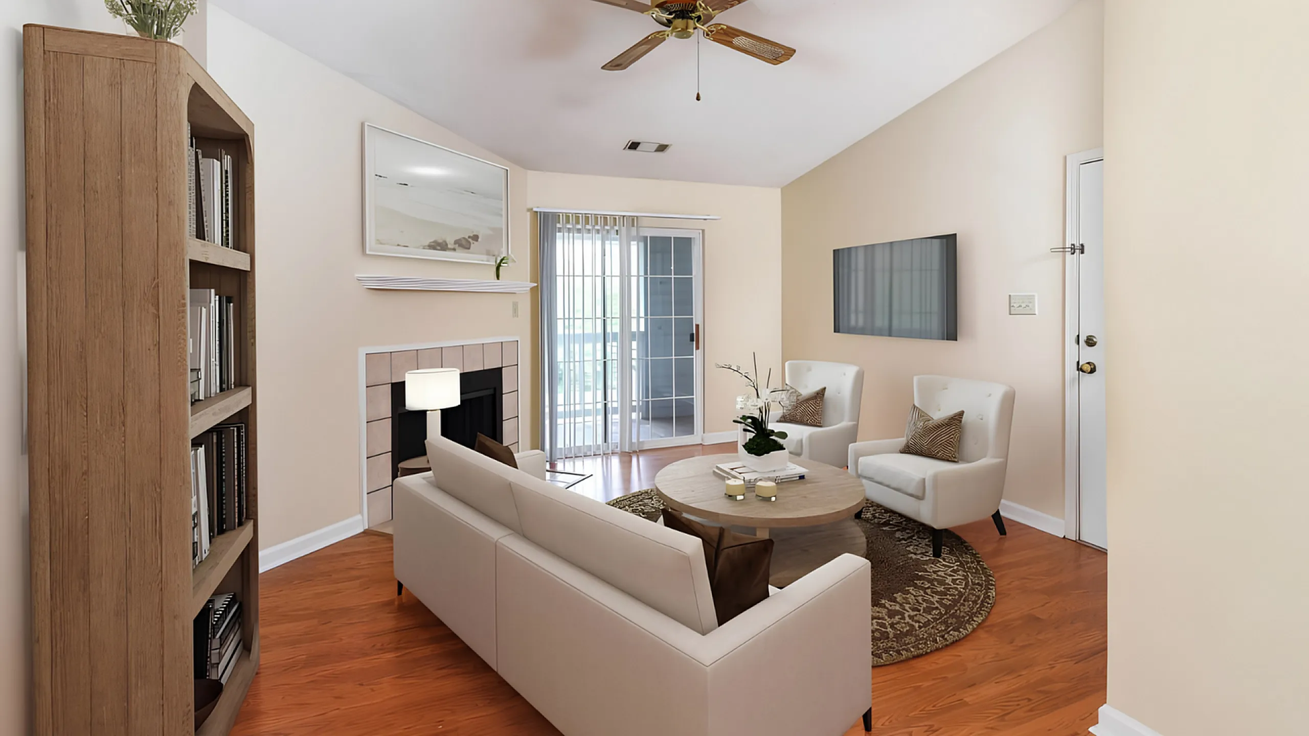 Charming living room with a cozy fireplace, elegant furnishings, and natural light streaming through glass doors, perfect for relaxation.