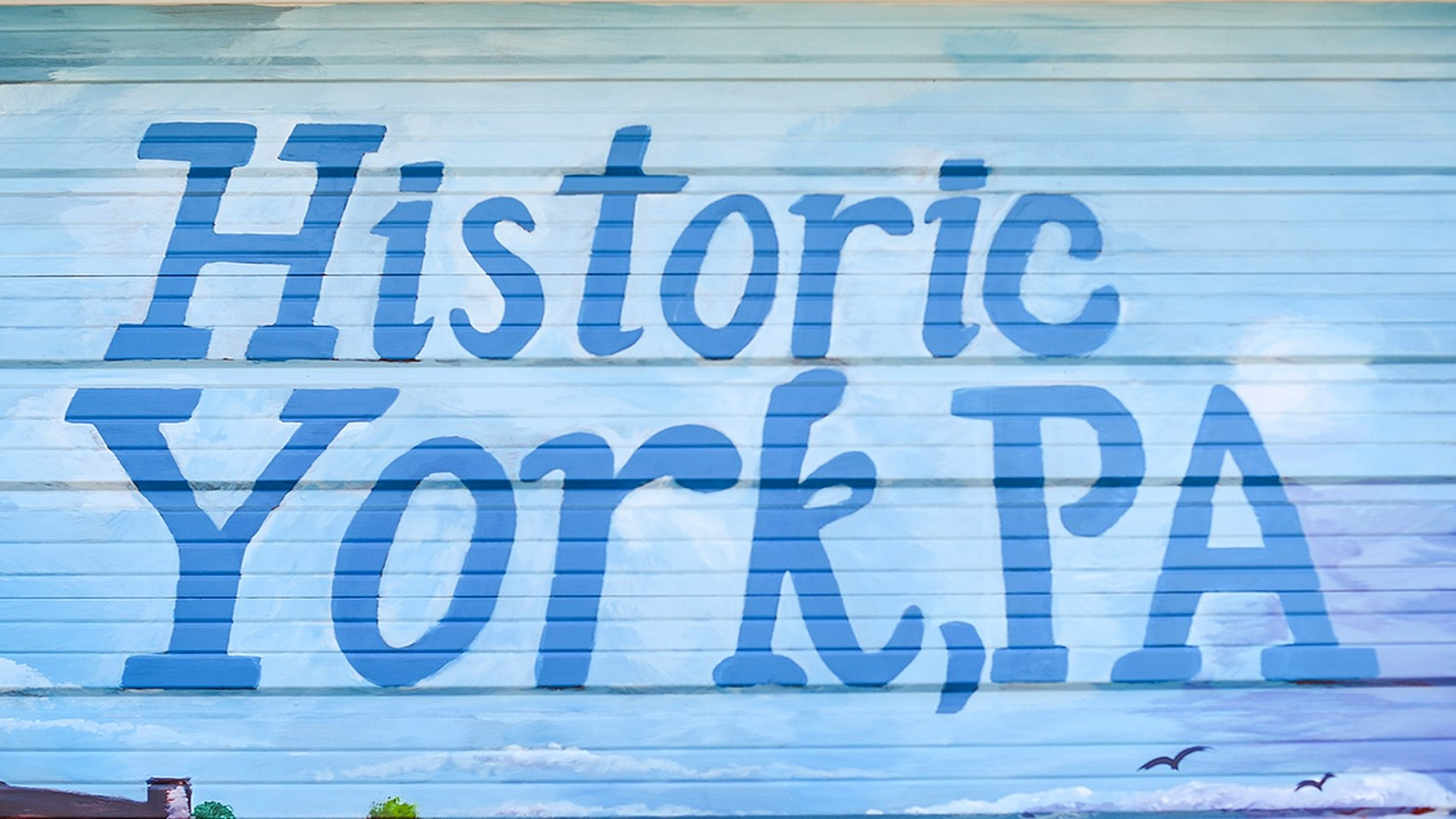 Charming mural showcasing 'Historic York, PA' with scenic sky and landscape accents.