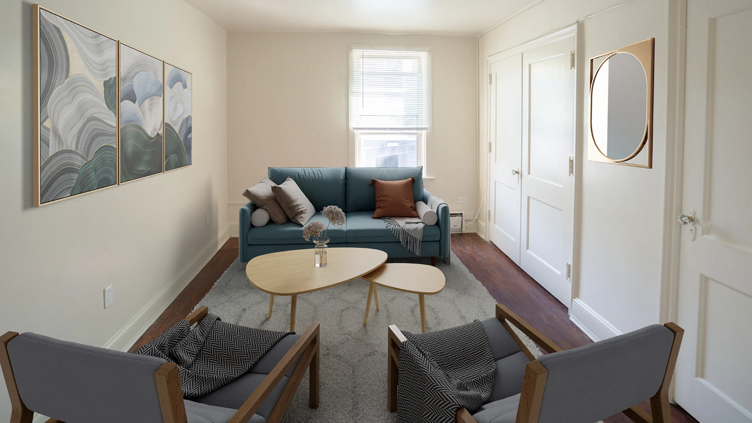 Cozy living room with modern furniture featuring a blue sofa, chic armchairs, and stylish artwork, enhanced by soft natural lighting.
