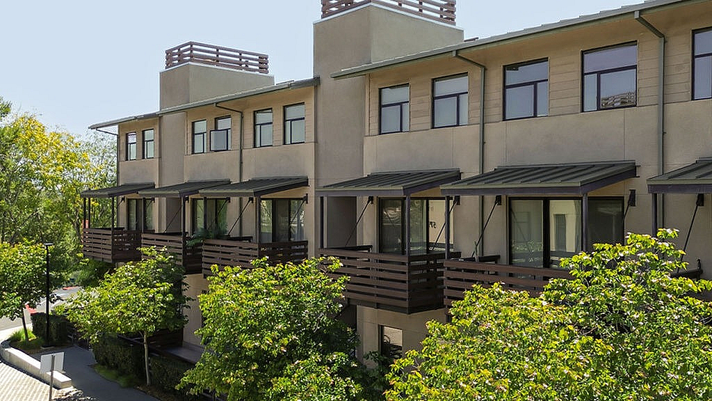 Modern apartments featuring stylish balconies and offering a serene and inviting urban living experience.