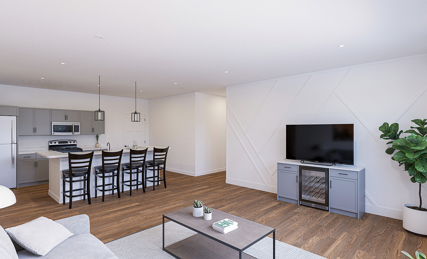 Modern open-concept living area featuring a sleek kitchen with bar seating, stylish decor, and natural lighting.