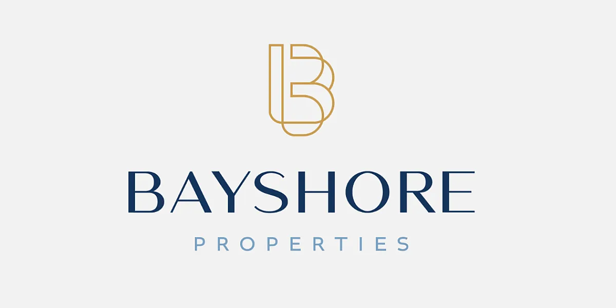 Elegant Bayshore Properties logo featuring a stylish gold and navy monogram design.