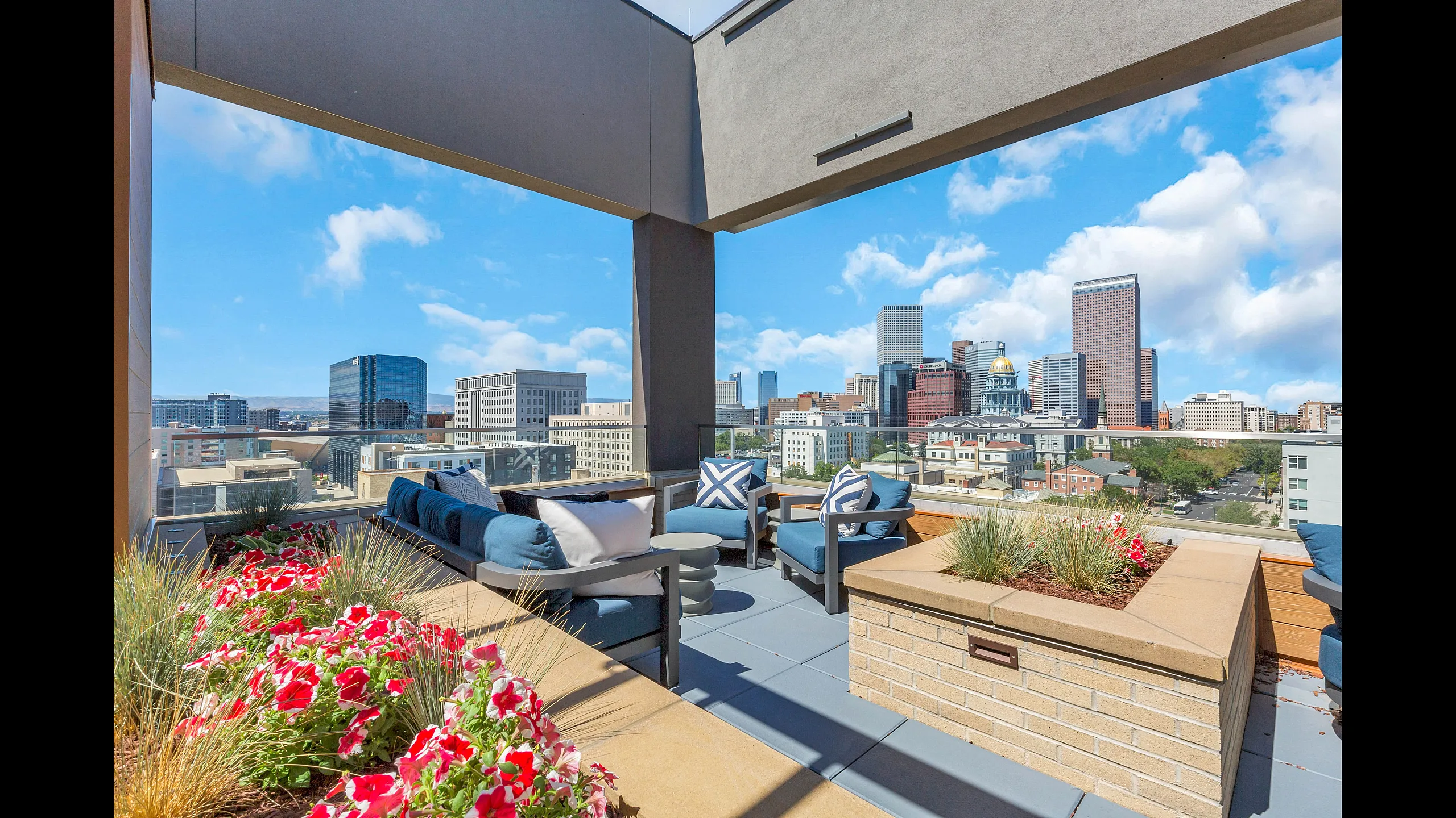 Inviting rooftop patio with stylish seating and vibrant city skyline views, perfect for relaxation and entertaining.