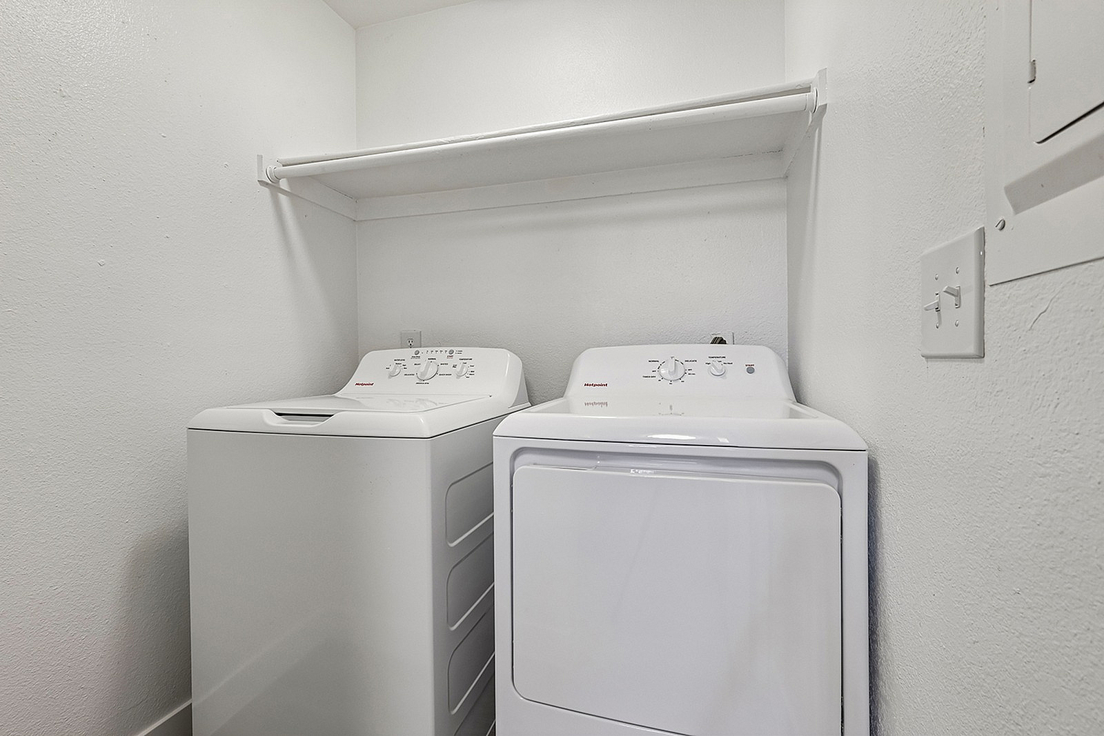 Modern laundry room featuring sleek washer and dryer appliances, perfect for efficient home living.