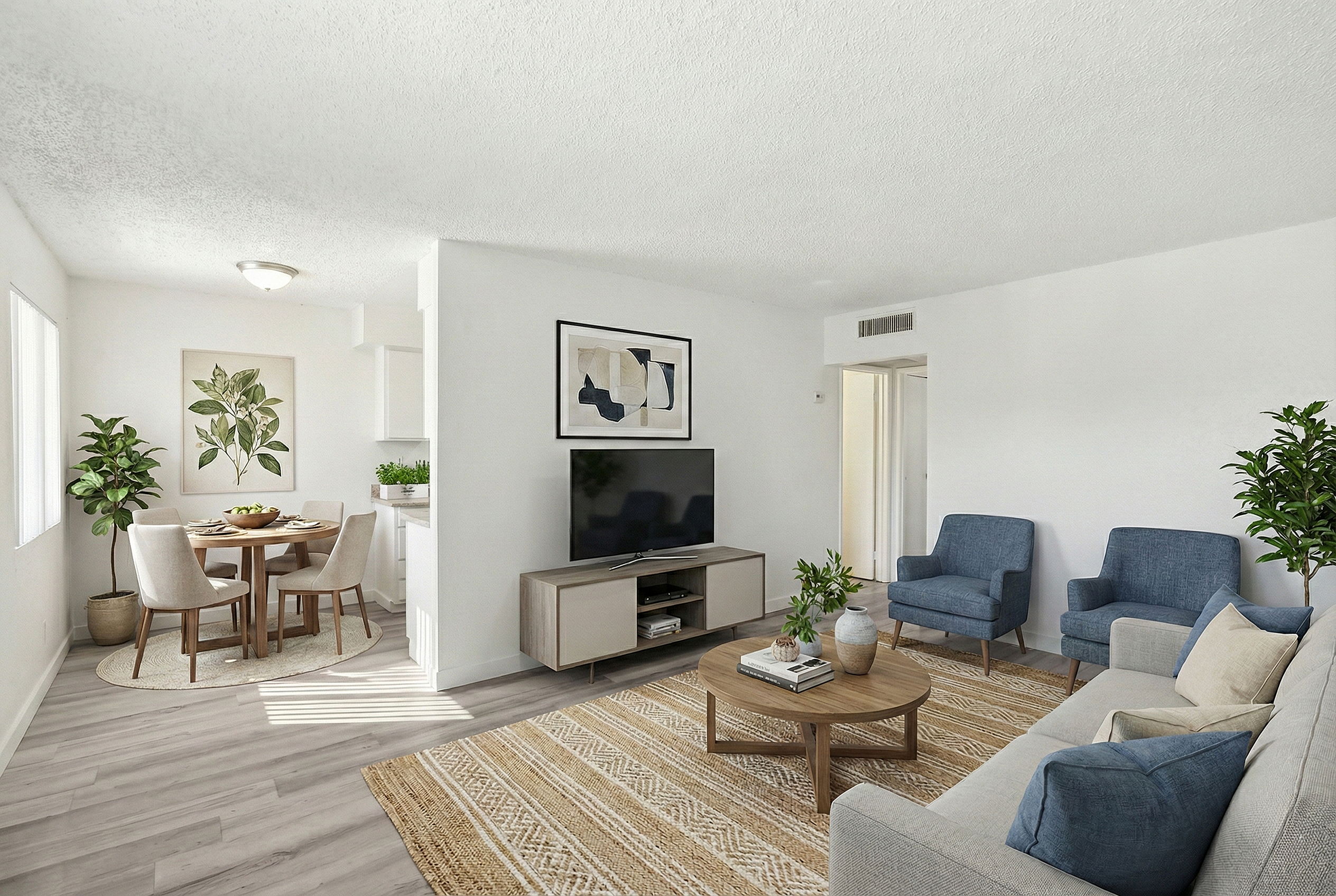Bright and inviting living space with modern furniture, natural light, and a cozy dining area, perfect for relaxation and entertainment.