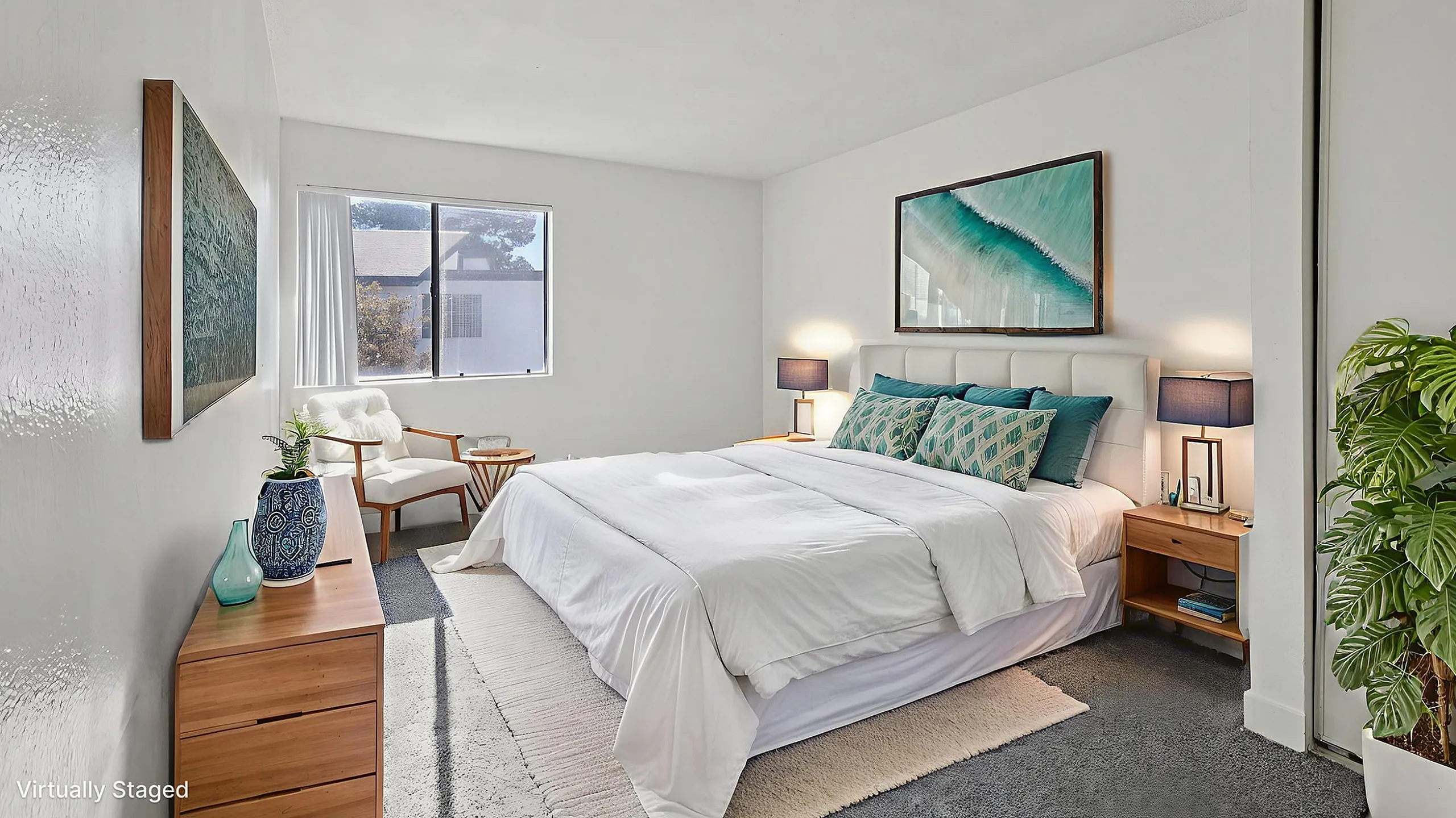 Virtually staged bedroom with modern decor, featuring a cozy bed with stylish pillows, elegant side tables, and a calming coastal artwork above the headboard, all illuminated by soft natural light through a large window.