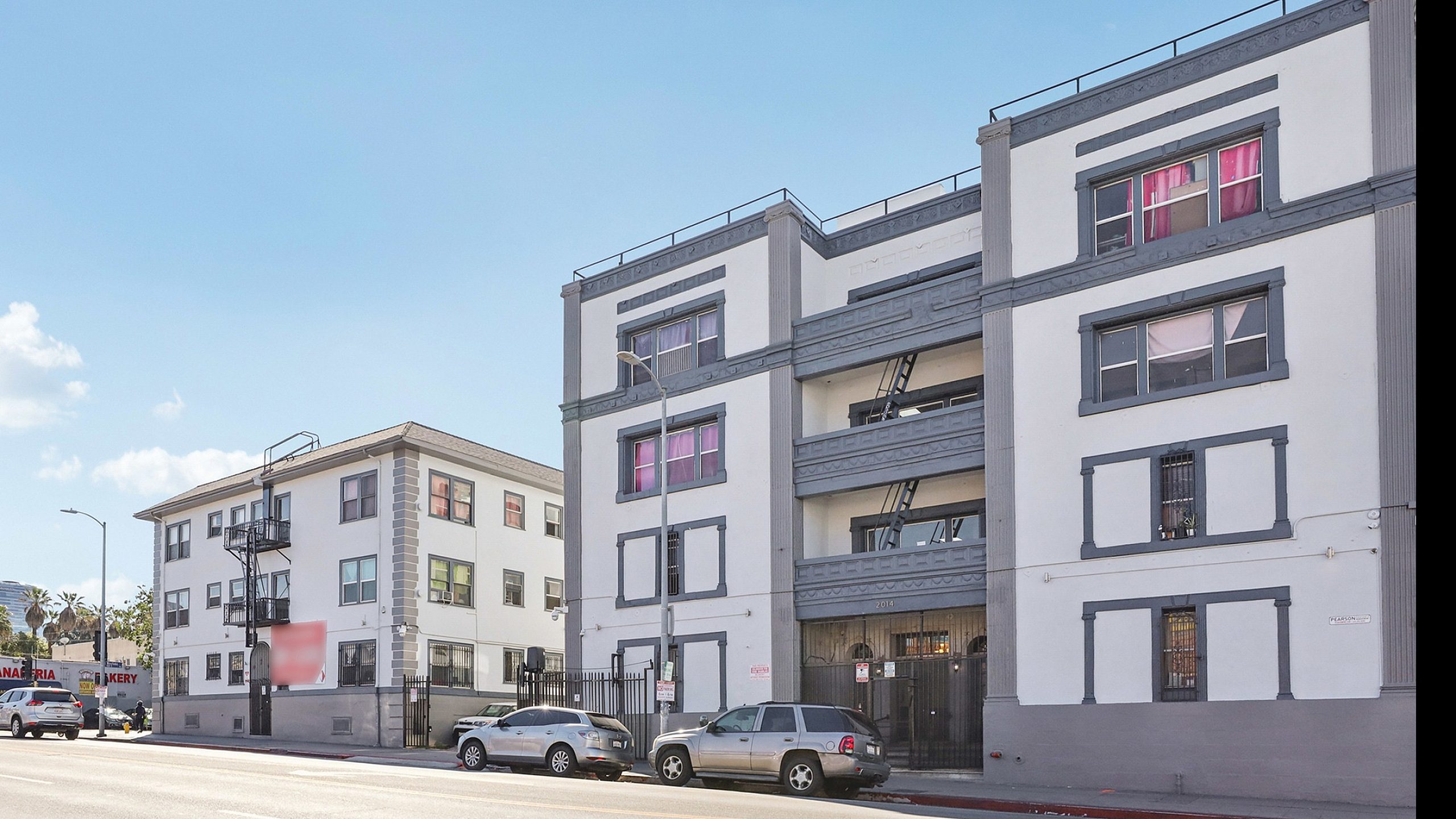 Charming urban apartments with distinct architectural details, located in a vibrant neighborhood with easy access to local amenities.