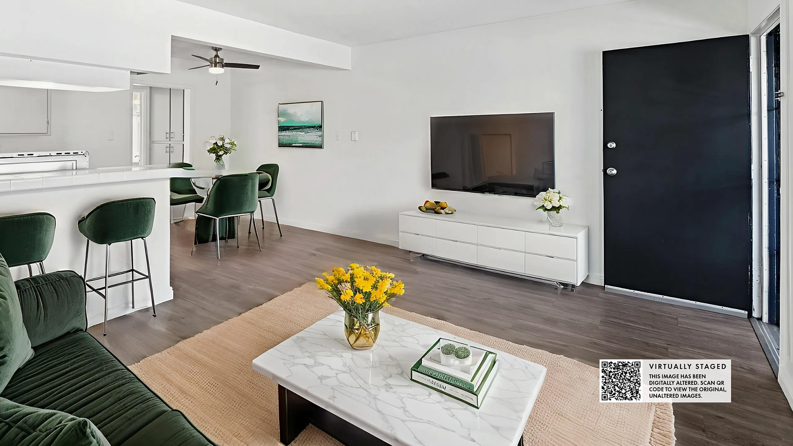 Bright and modern living space with elegant green furniture, a sleek TV setup, and a chic white bar area, perfect for cozy gatherings.