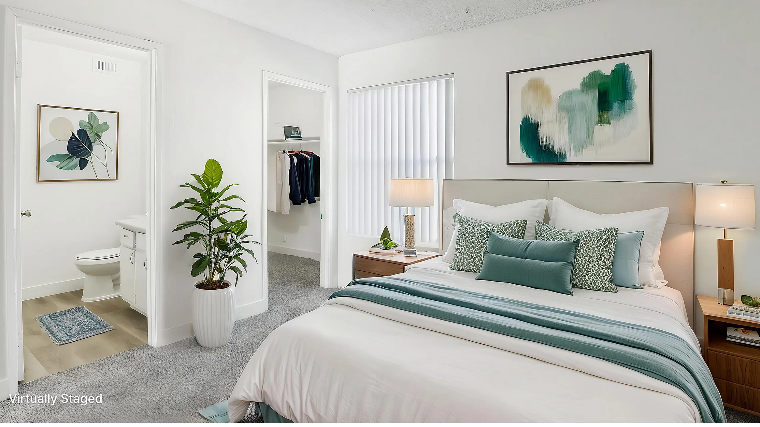 Bright and modern bedroom with elegant decor, featuring a plush bed, stylish artwork, and lush plant, complemented by a walk-in closet and en-suite bathroom.