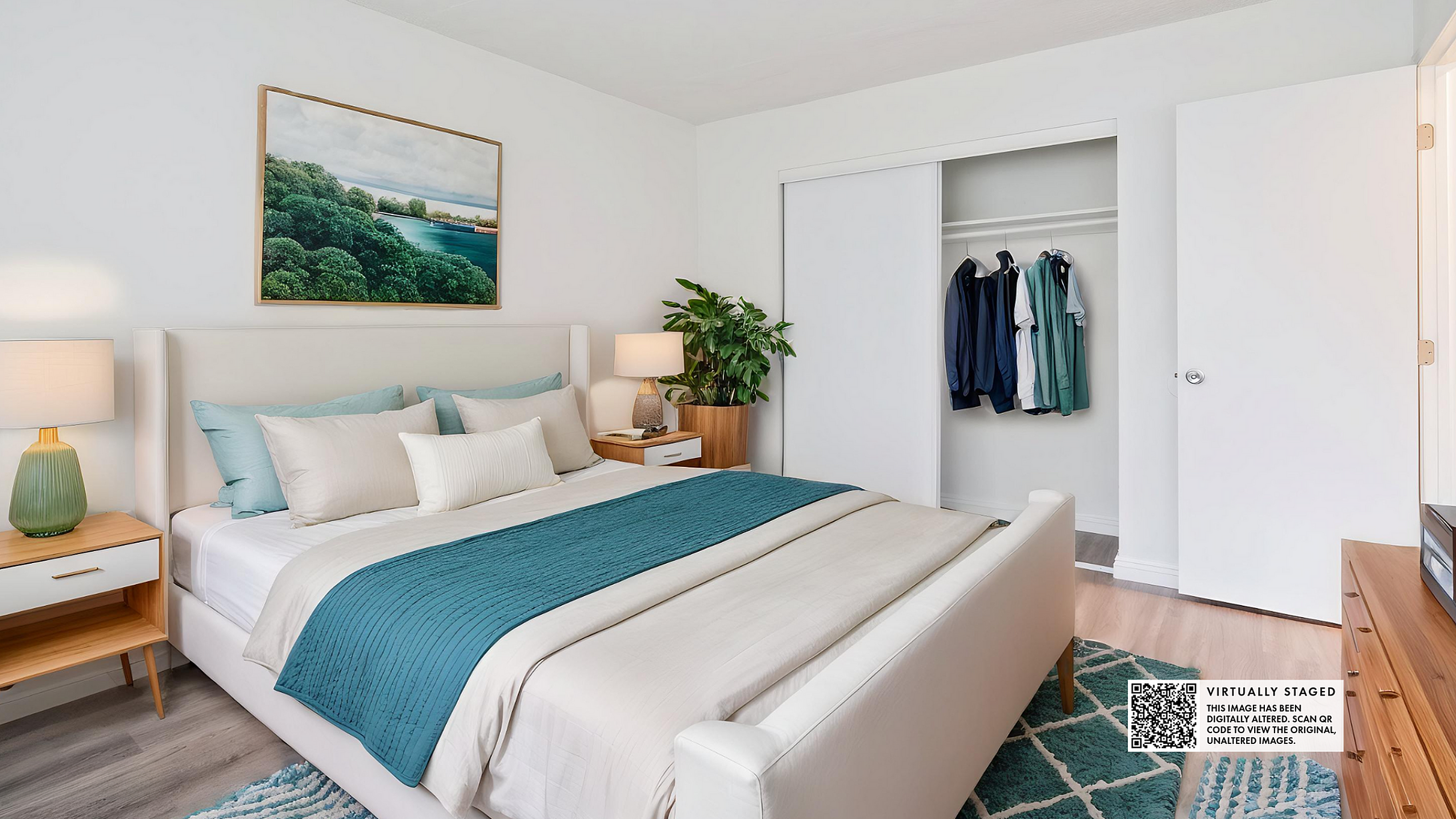 Modern bedroom with crisp white walls, cozy blue and beige bedding, stylish nightstands, and a spacious closet exhibiting a serene and inviting atmosphere.