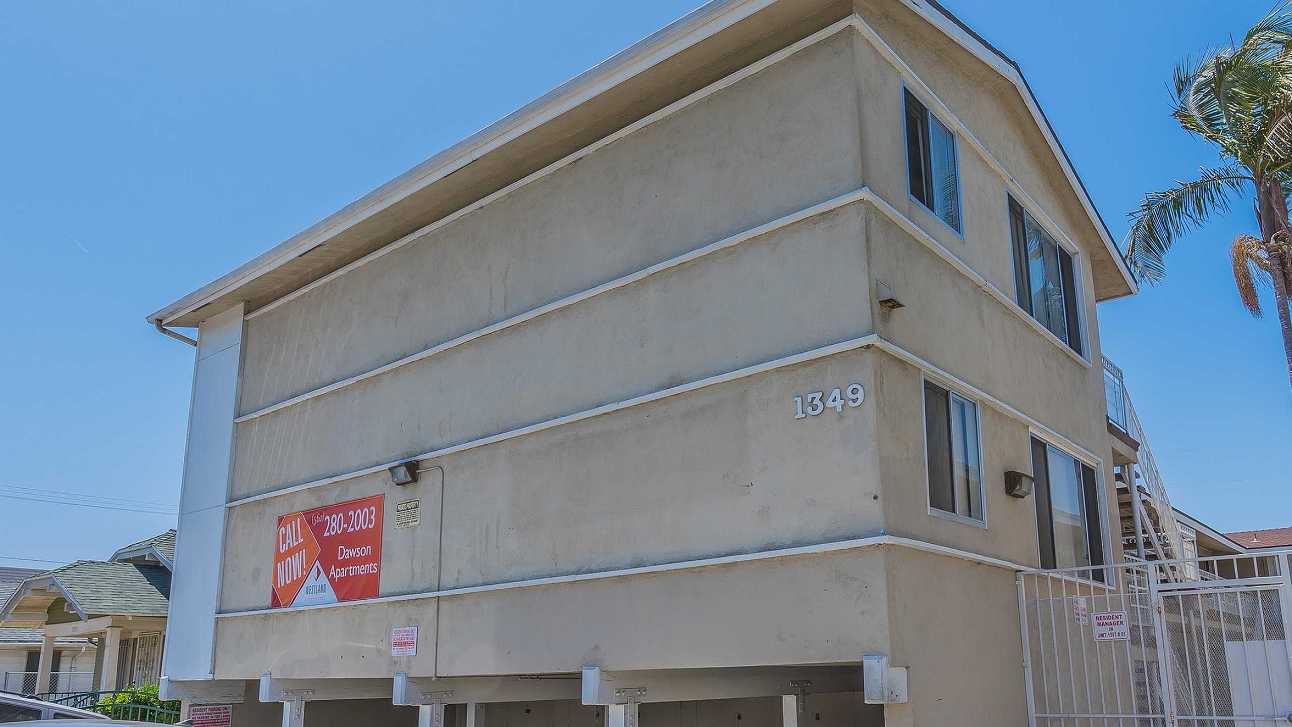 Bright and airy apartment building with covered parking, offering a welcoming atmosphere and convenient location.