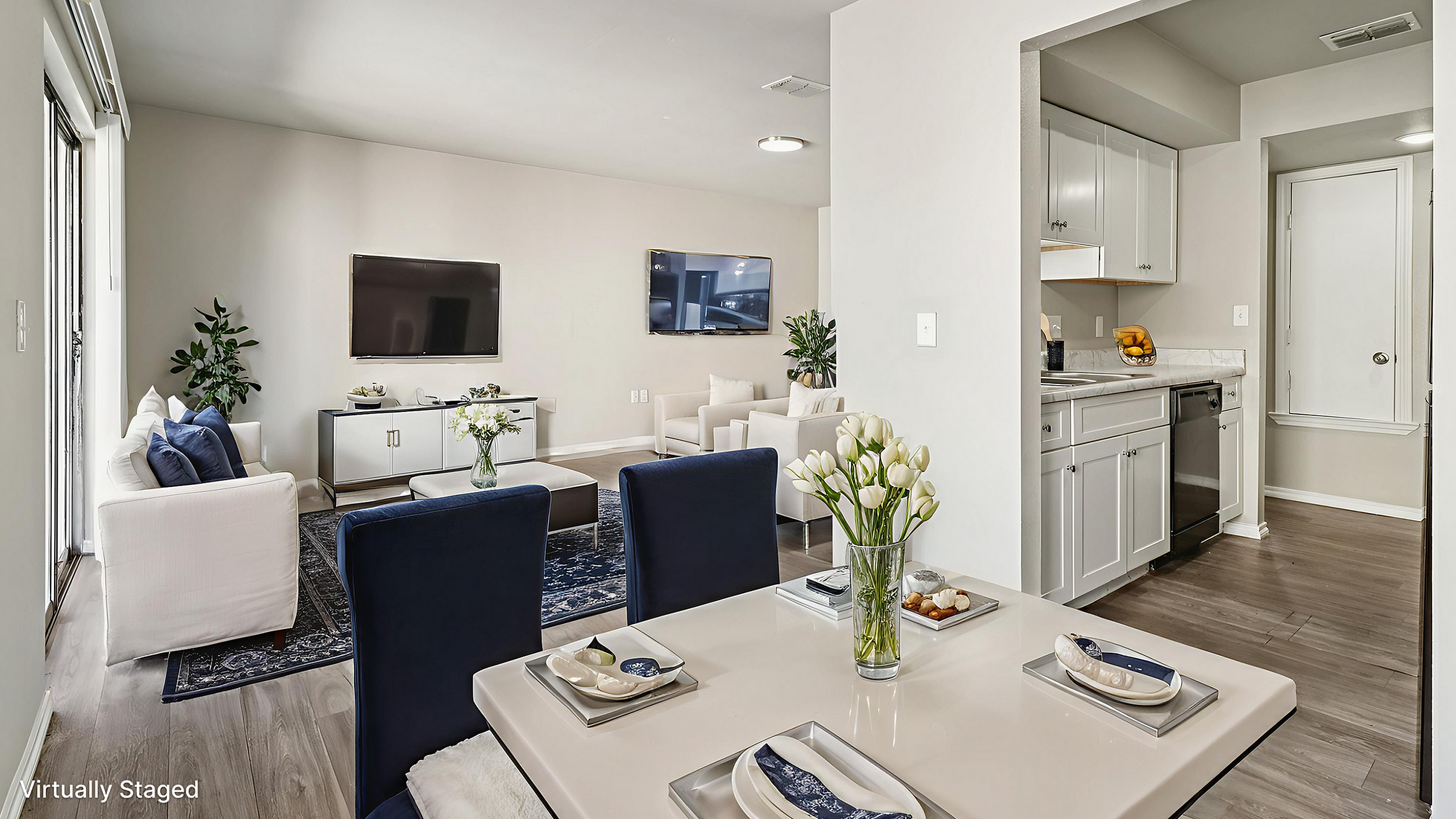 Modern open-concept living space with sleek kitchen, elegant dining area, and cozy seating, perfect for entertaining.