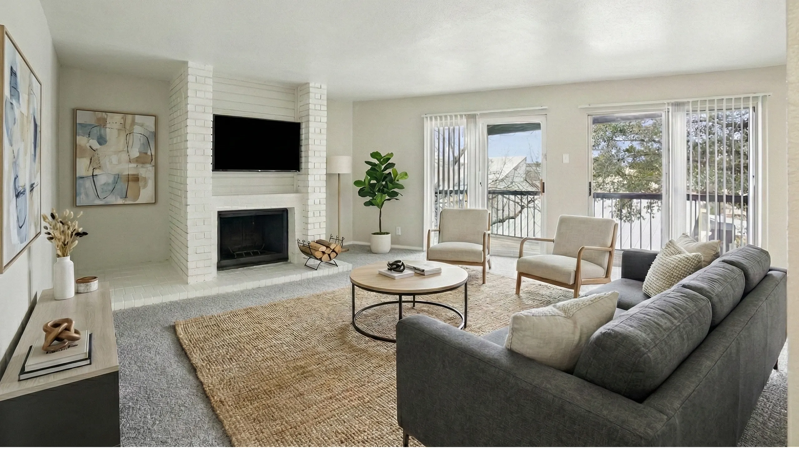 Bright and inviting living room with a modern fireplace, large windows, and stylish decor, perfect for relaxation and entertaining.