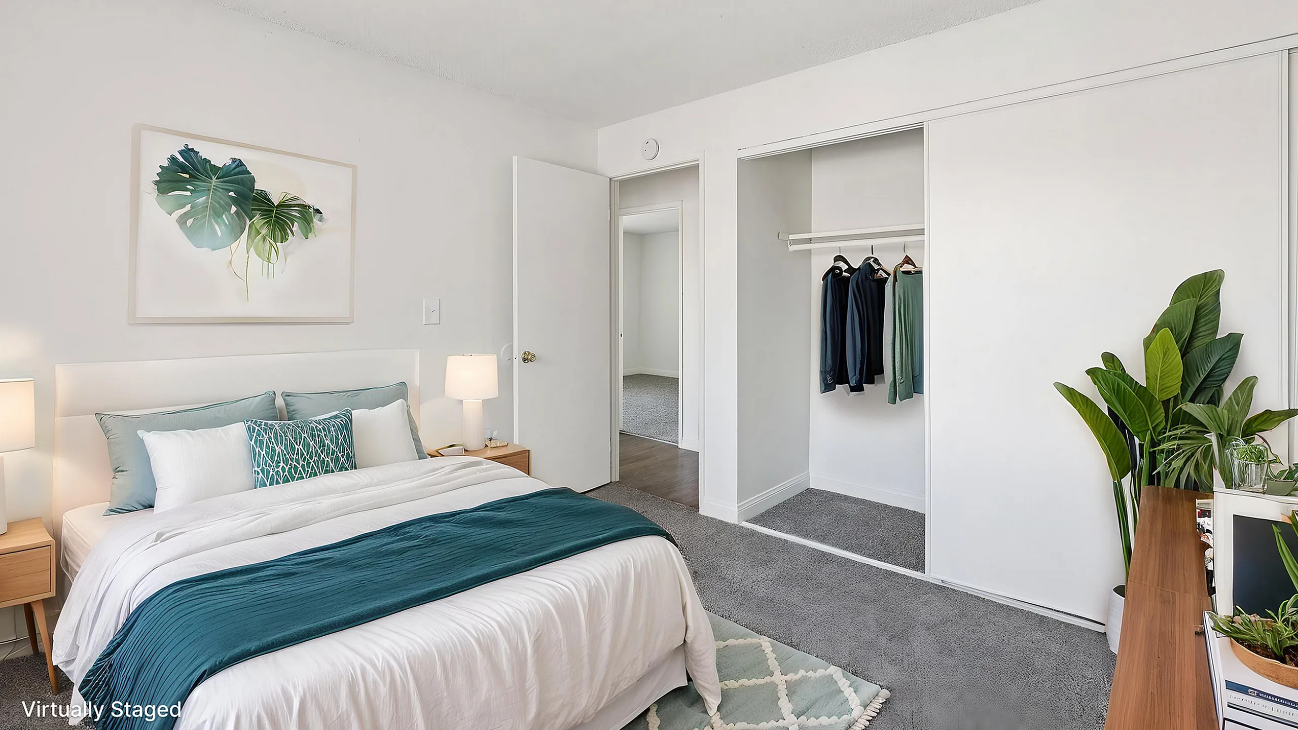 Bright and stylishly staged bedroom with modern furniture, cozy bedding, elegant decor, and abundant natural light.