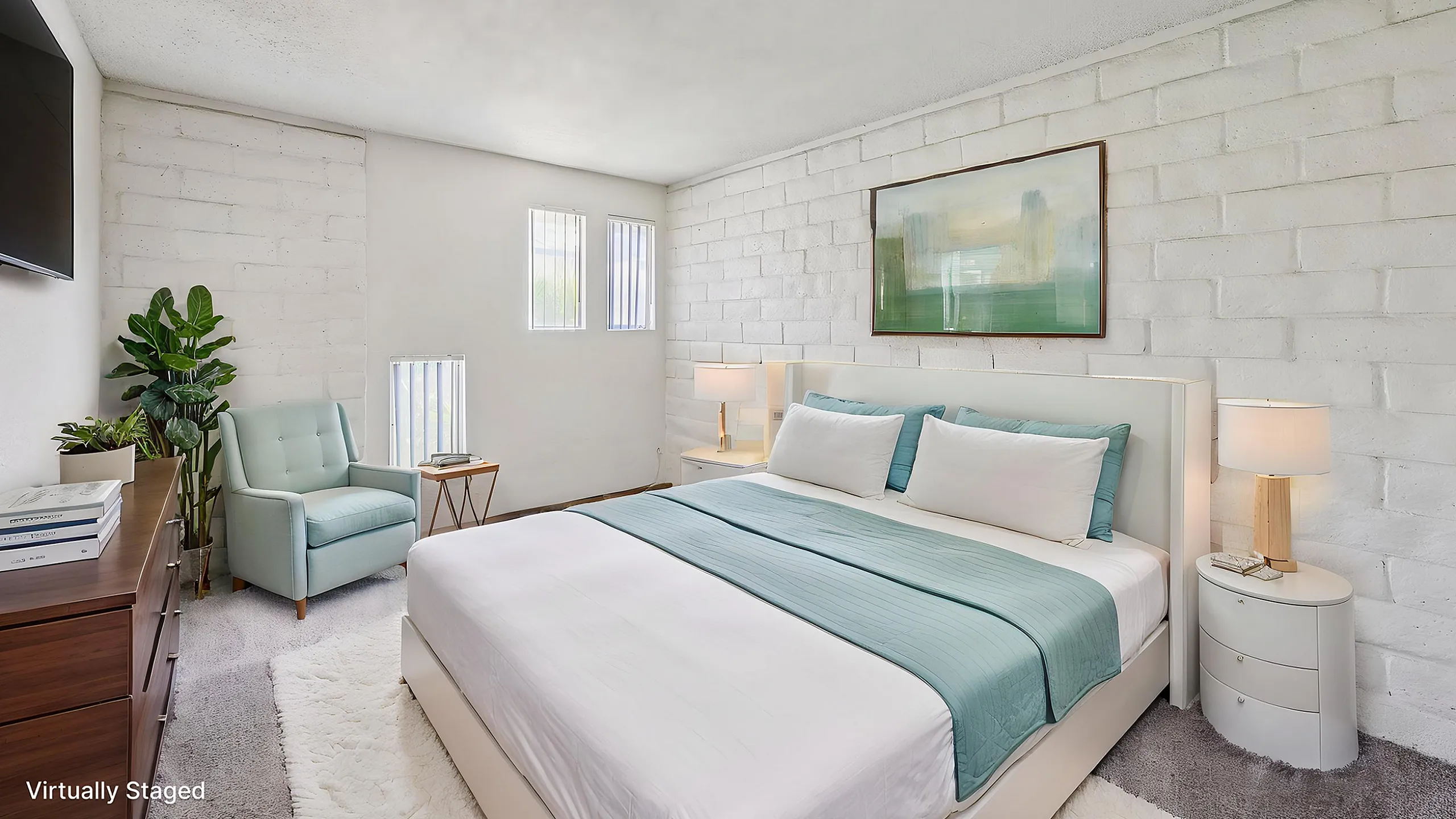 Bright and inviting bedroom with modern decor, featuring a plush bed, stylish nightstands, and a cozy reading chair by sunlit windows.