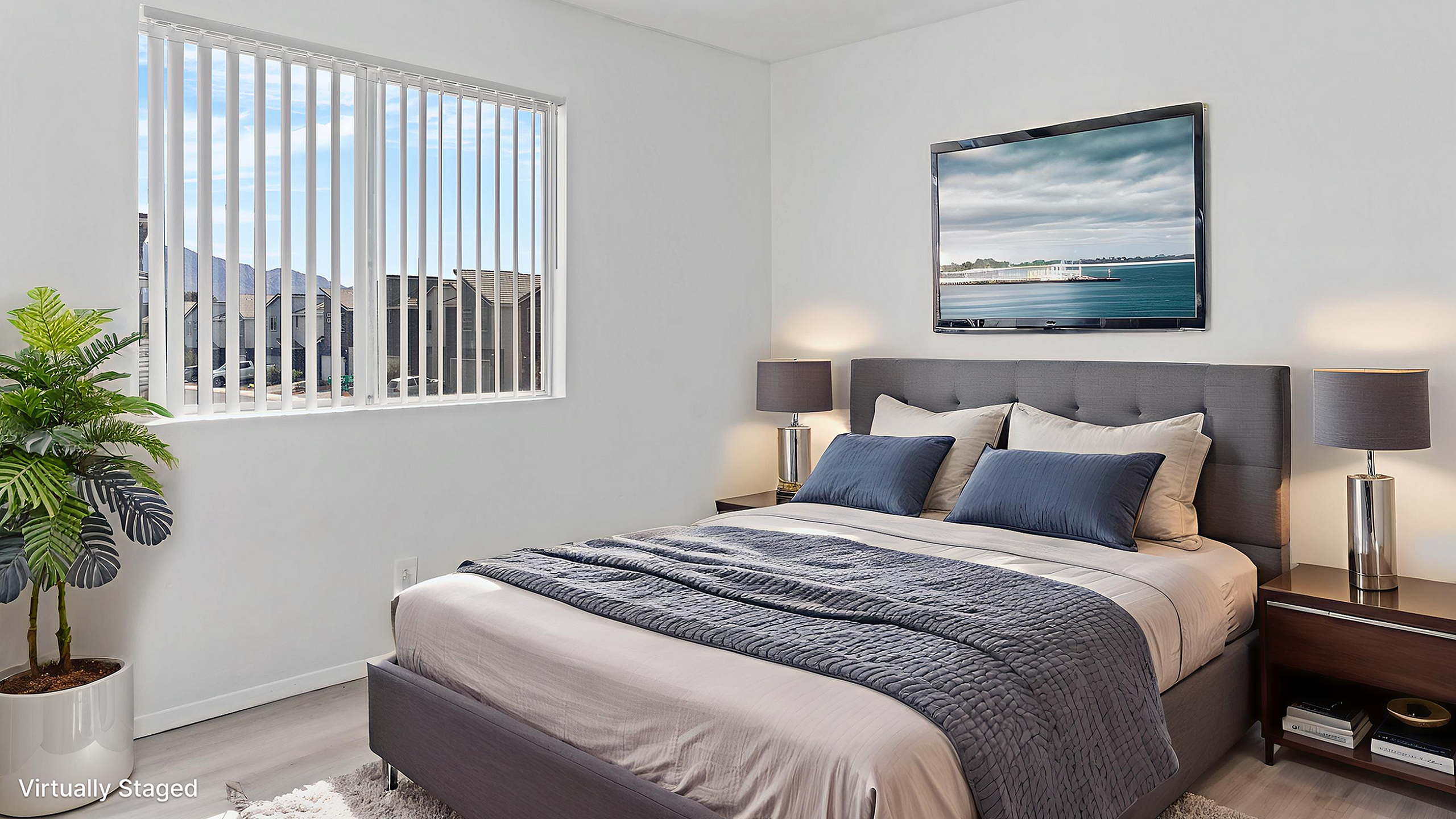 Elegant bedroom with modern decor, featuring a plush bed with cozy pillows, stylish nightstands, and a scenic window view.