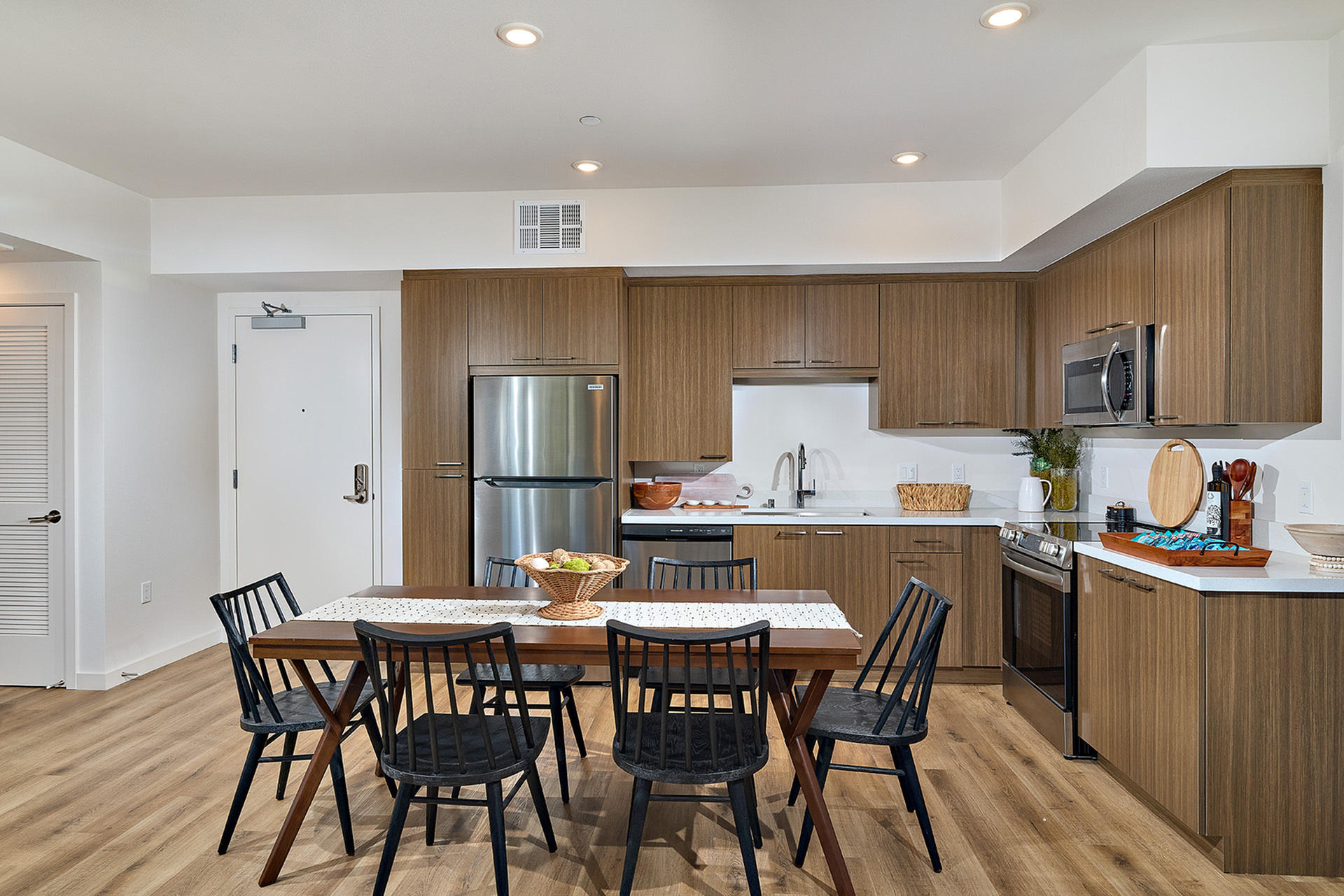 open kitchen layout with stainless steel appliance and granite countertops at the hixon