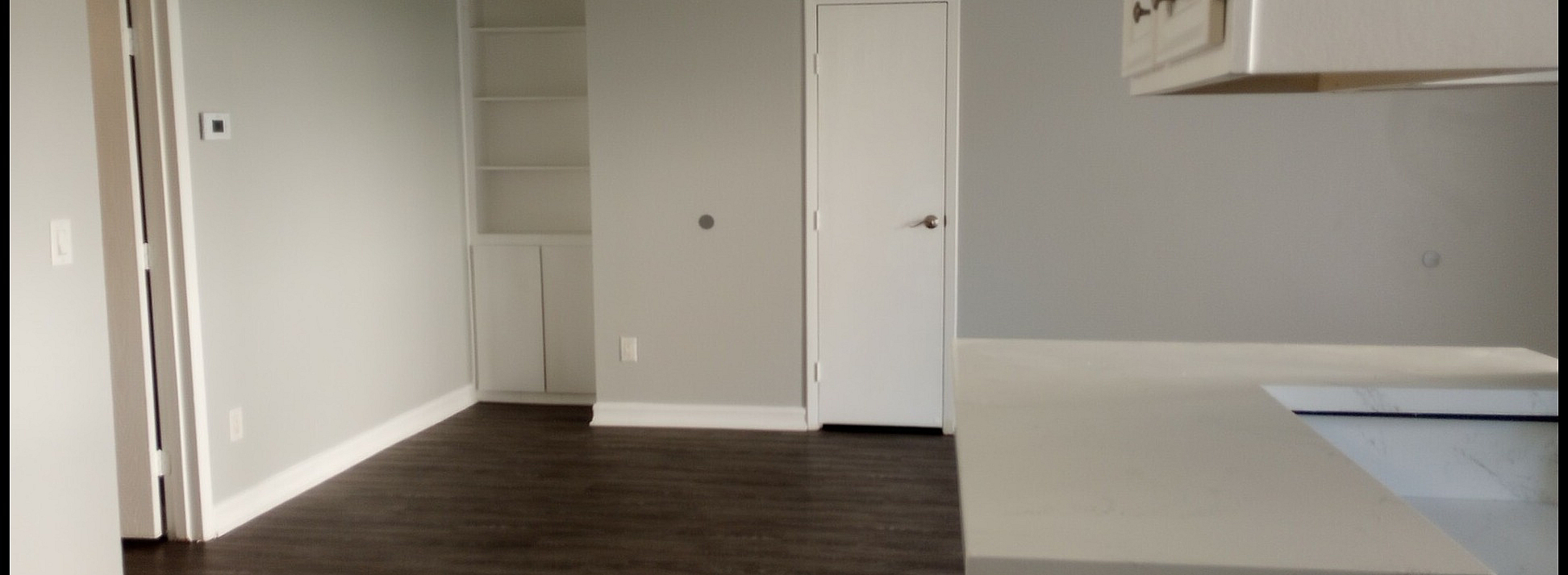 living space with connected kitchen