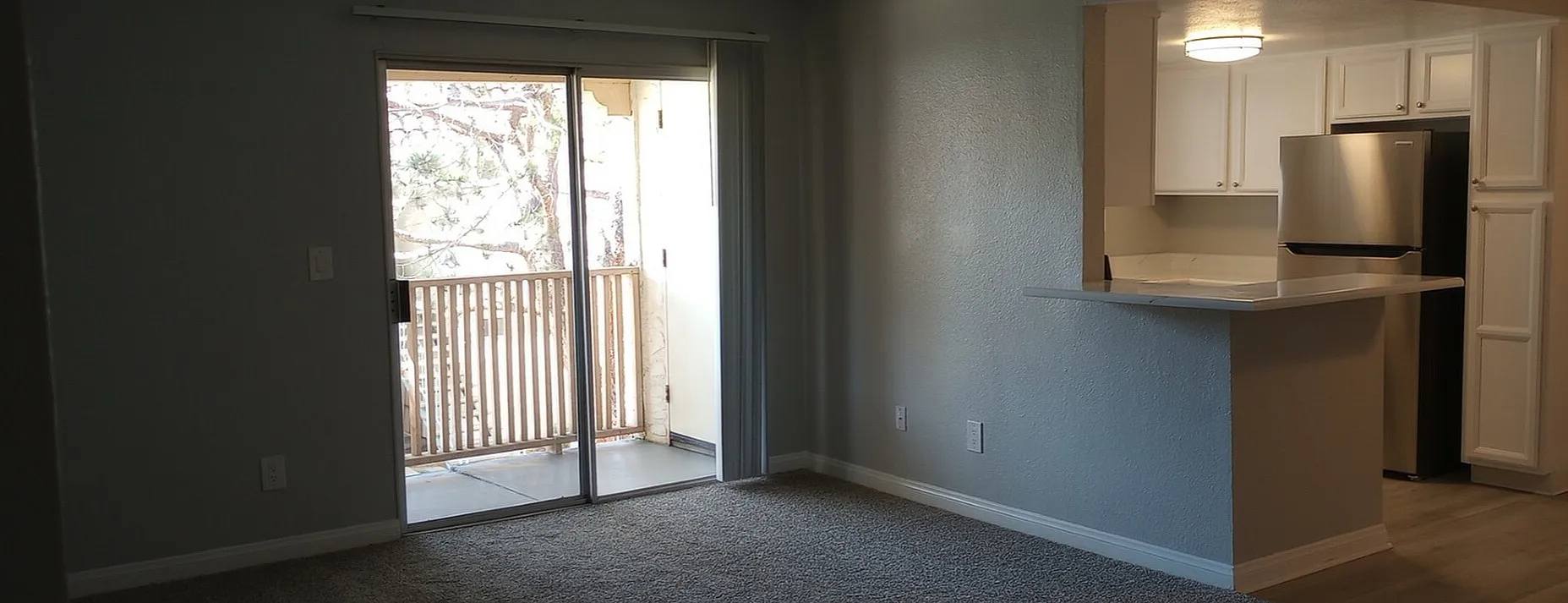 living space with large sliding glass doors