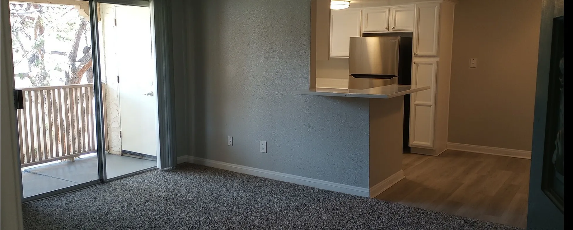 living space with connected kitchen