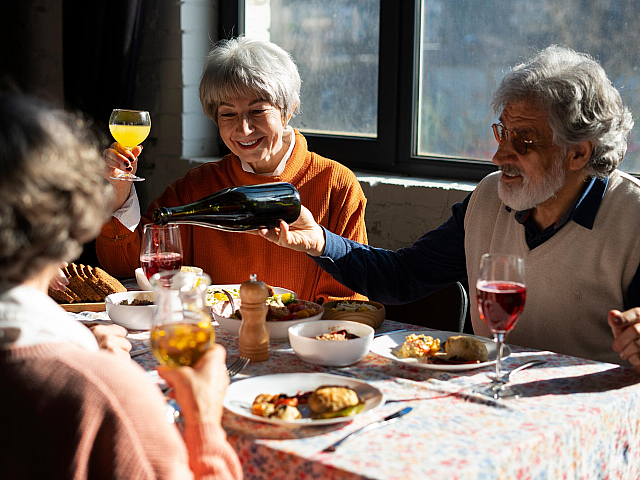 elder group of friends dining