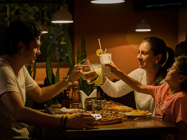 family of three having dinner at a restaurant