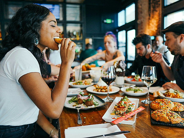 woman and friends eating at a restaurant