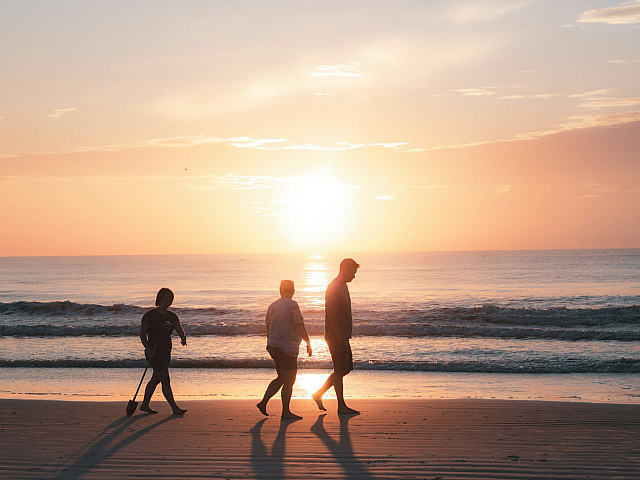 walking on the beach at sunset