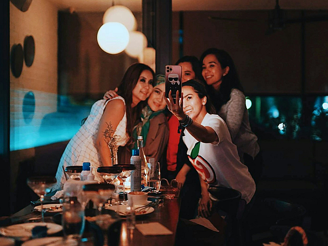 group of friends taking a photo