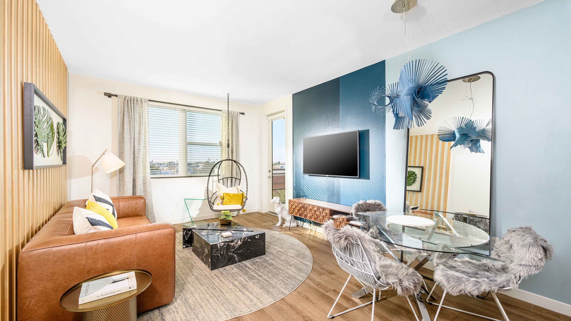 livingroom with leather sofa, wood like vinyl flooring at arte west apartments
