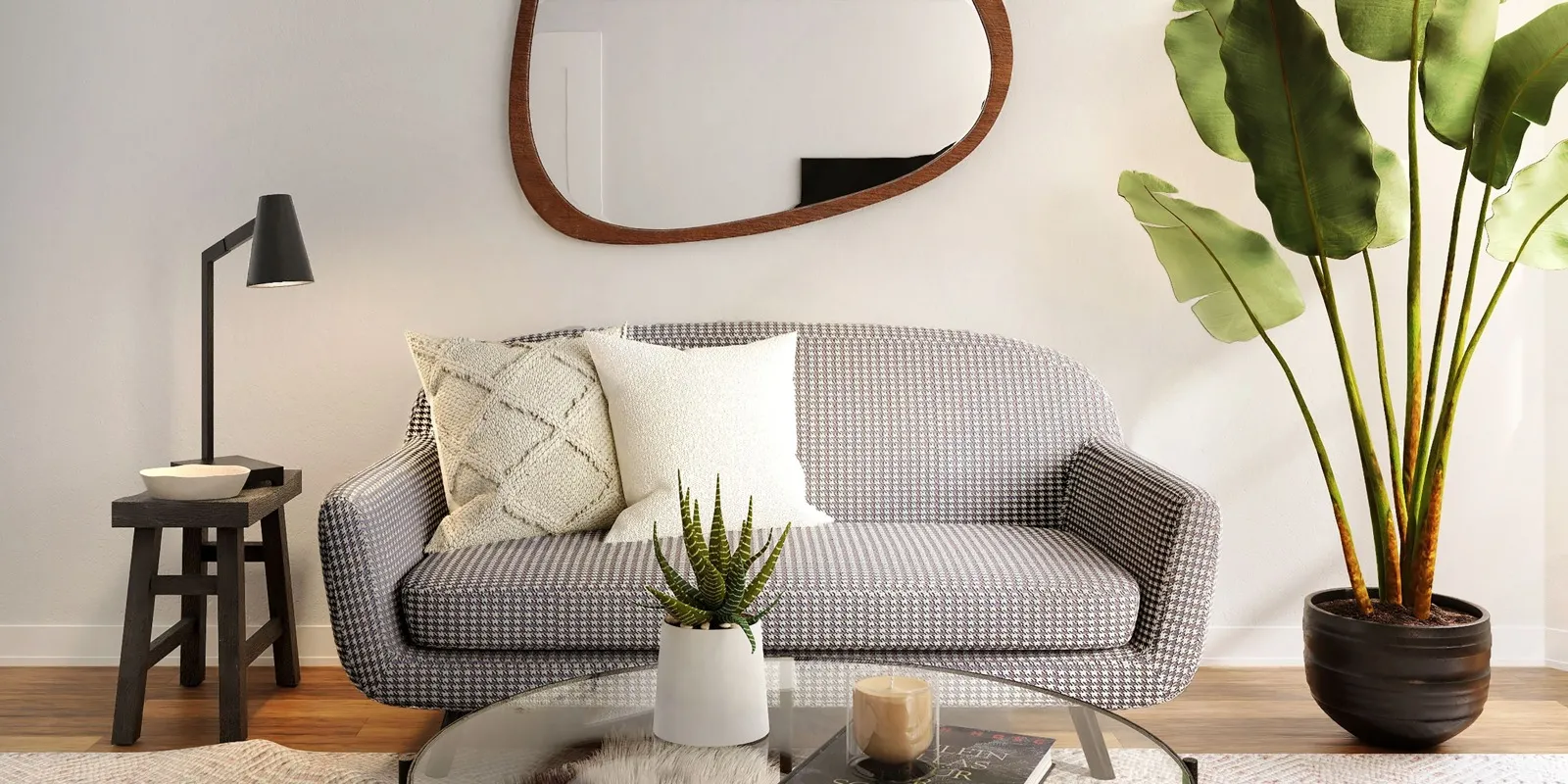 living room with grey sofa, a coffee table and a side table with a bowl and lamp