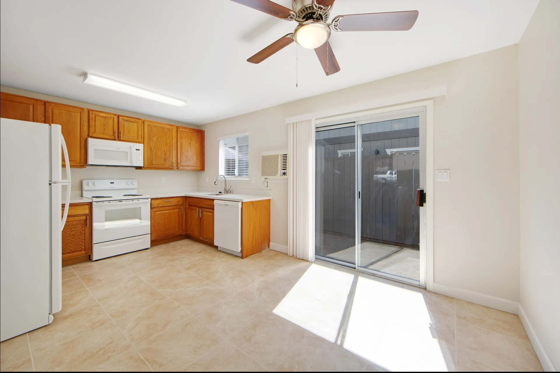 kitchen with white appliances and dining area