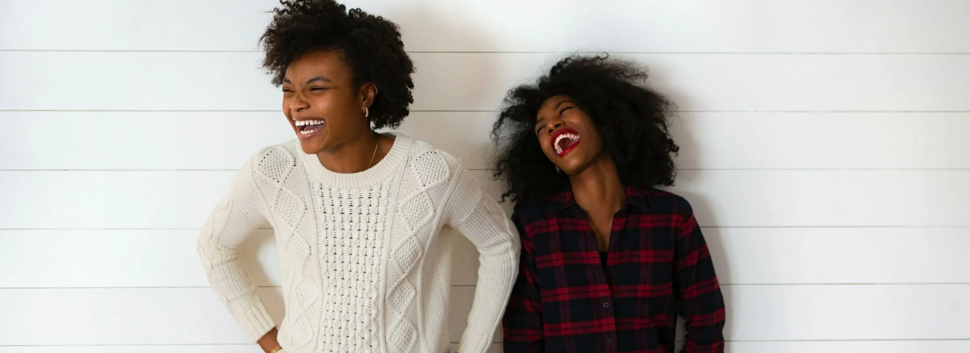 two women smiling and laughing