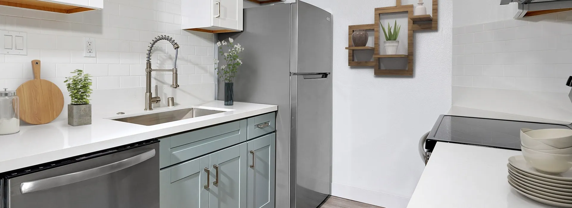 Virtually staged kitchen with subway tile backsplash, farmhouse sink, quartz countertops and dual-tone cabinetry