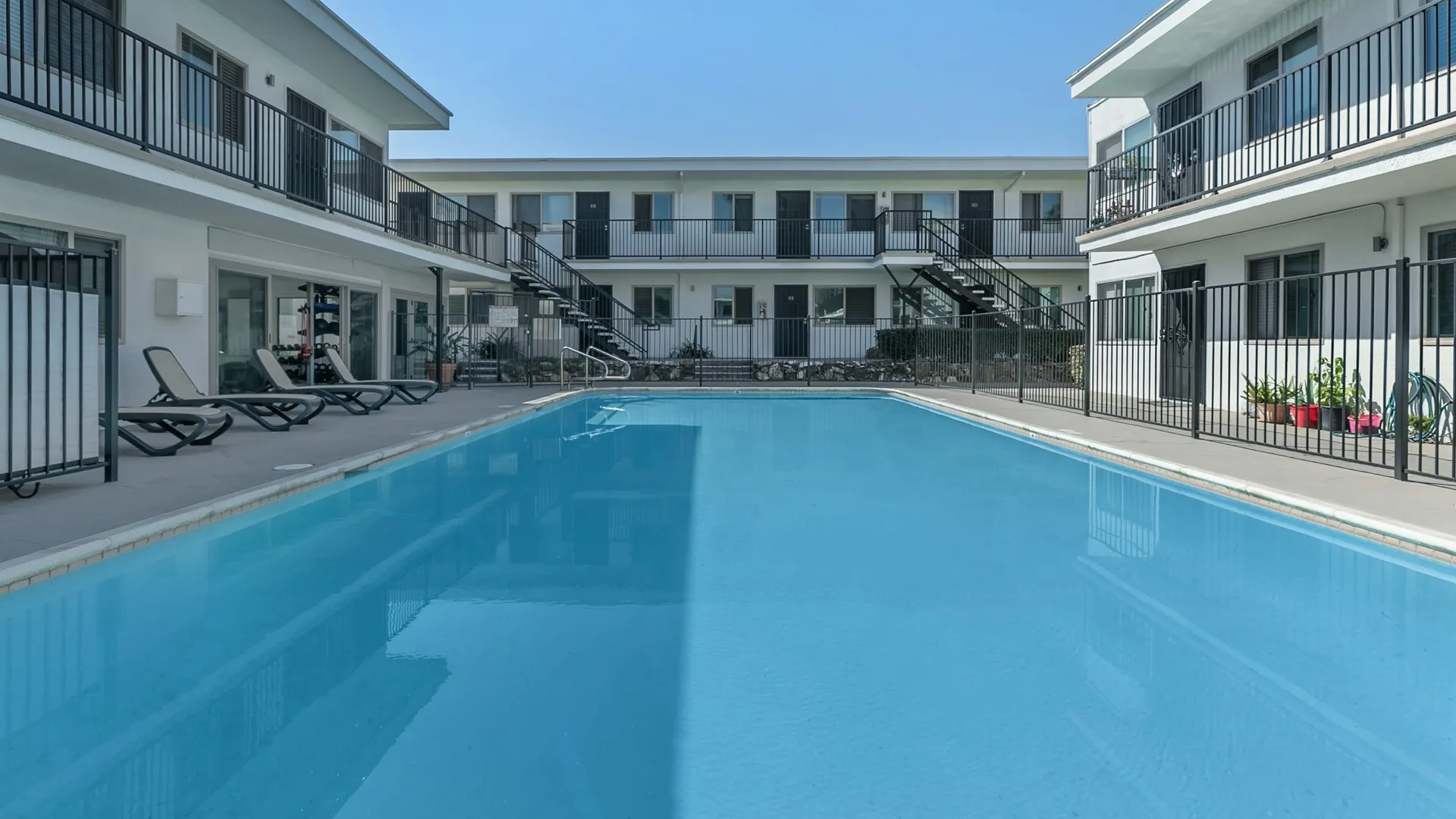 Pool and lounge area that leads into gym