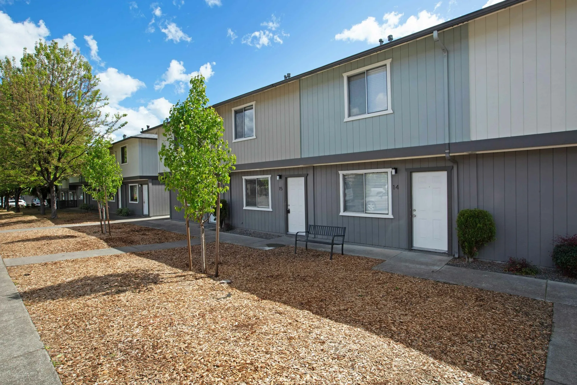 front of two story apartment building and trees in common areas at The villas ukiah