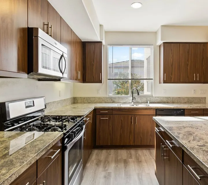 Kitchen with granite countertops and stainless steel appliances