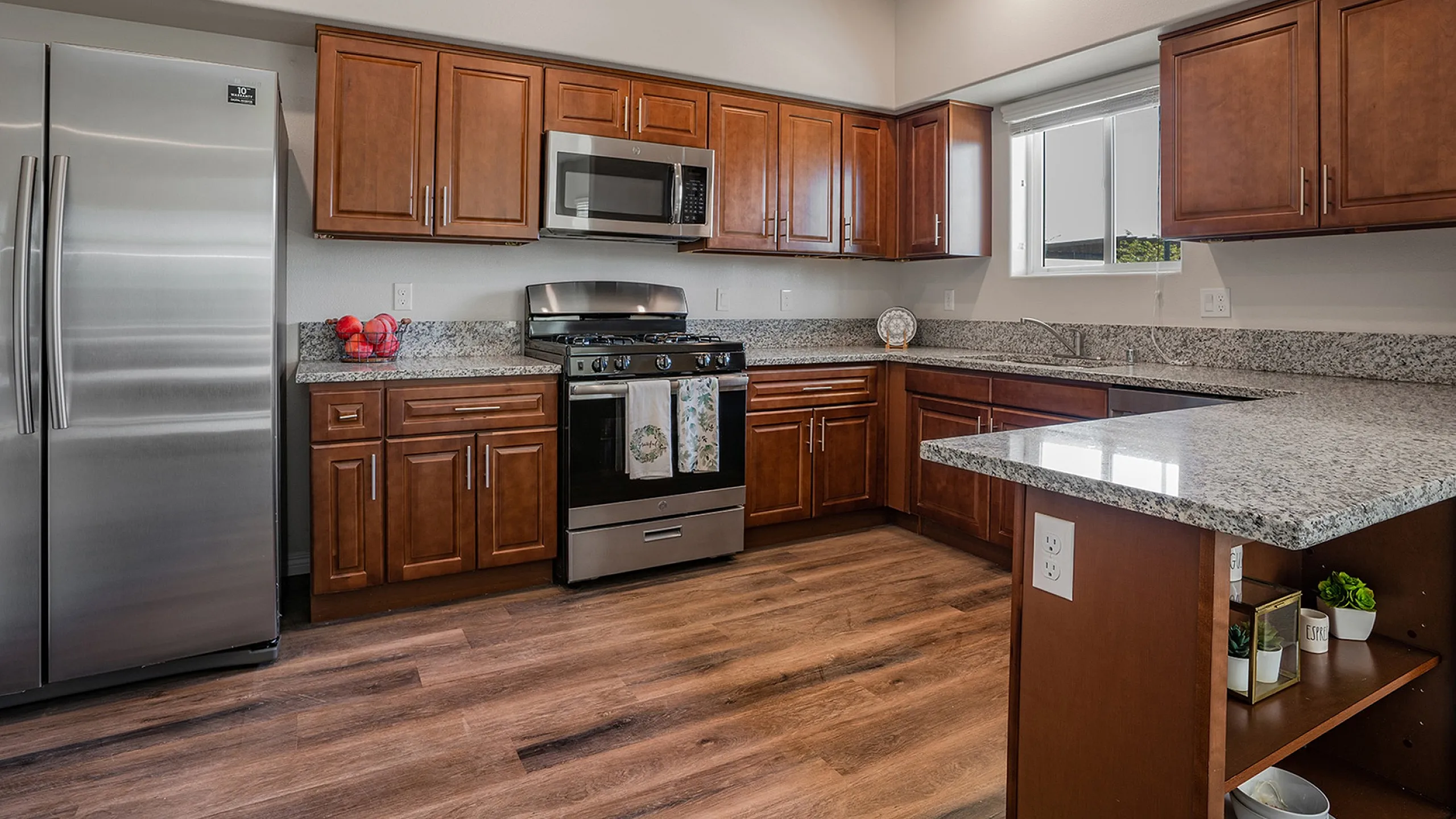 kitchen with stainless steel appliances and faux-wood like flooring at Grapevine Villa