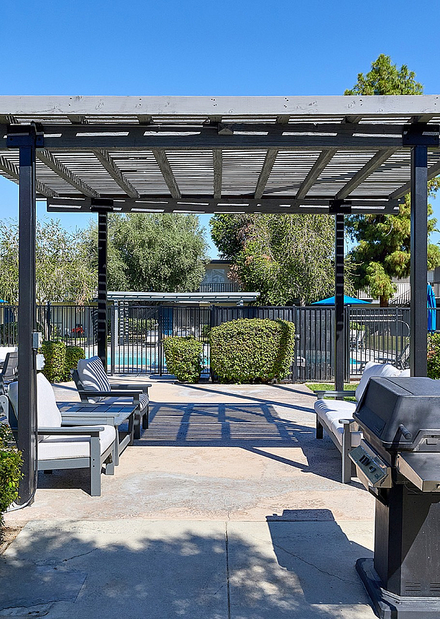 resident lounge area with bbq grills