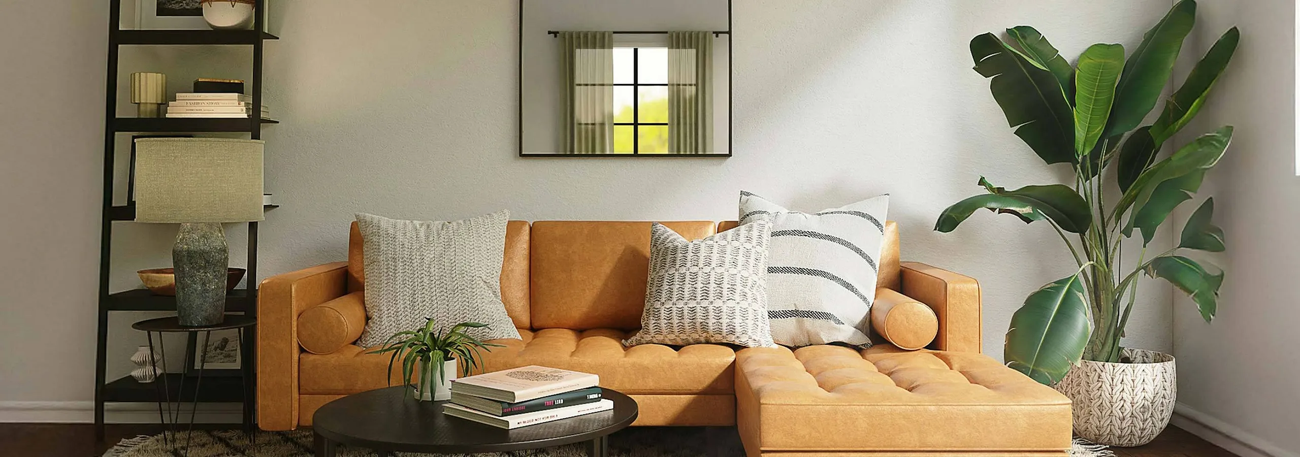 light brown leather sofa with large pillows and planter to the side