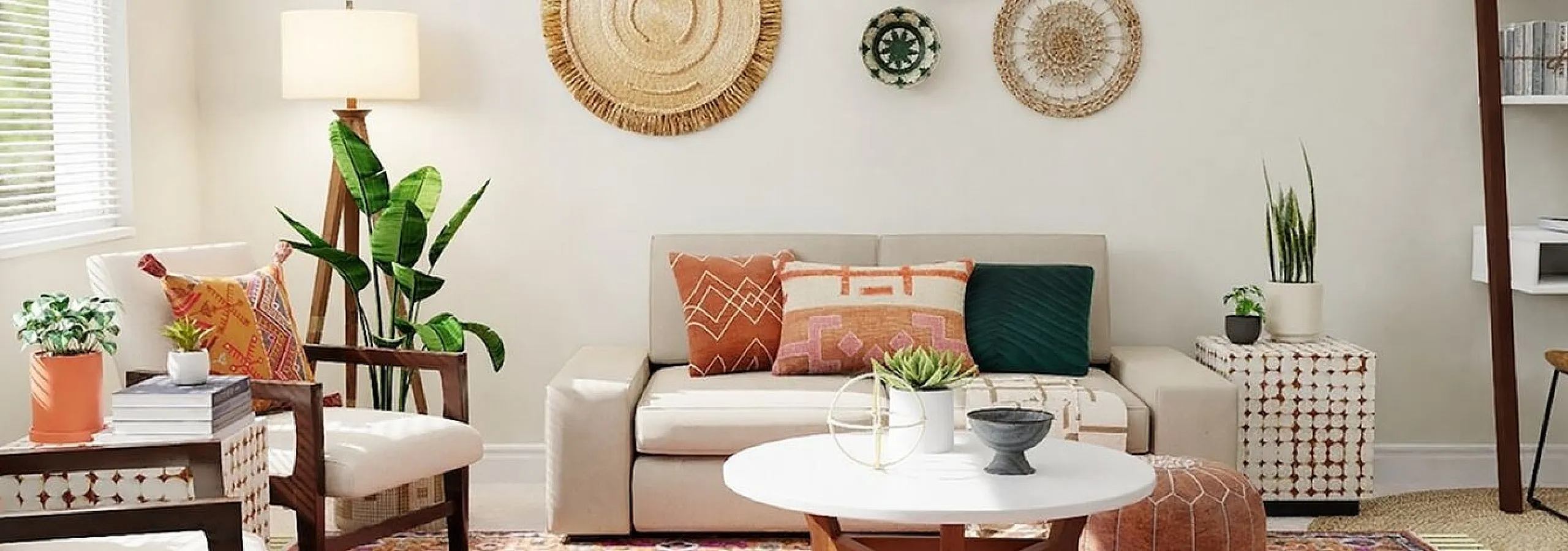 beige sofa with accent pillows and decorative art on the wall